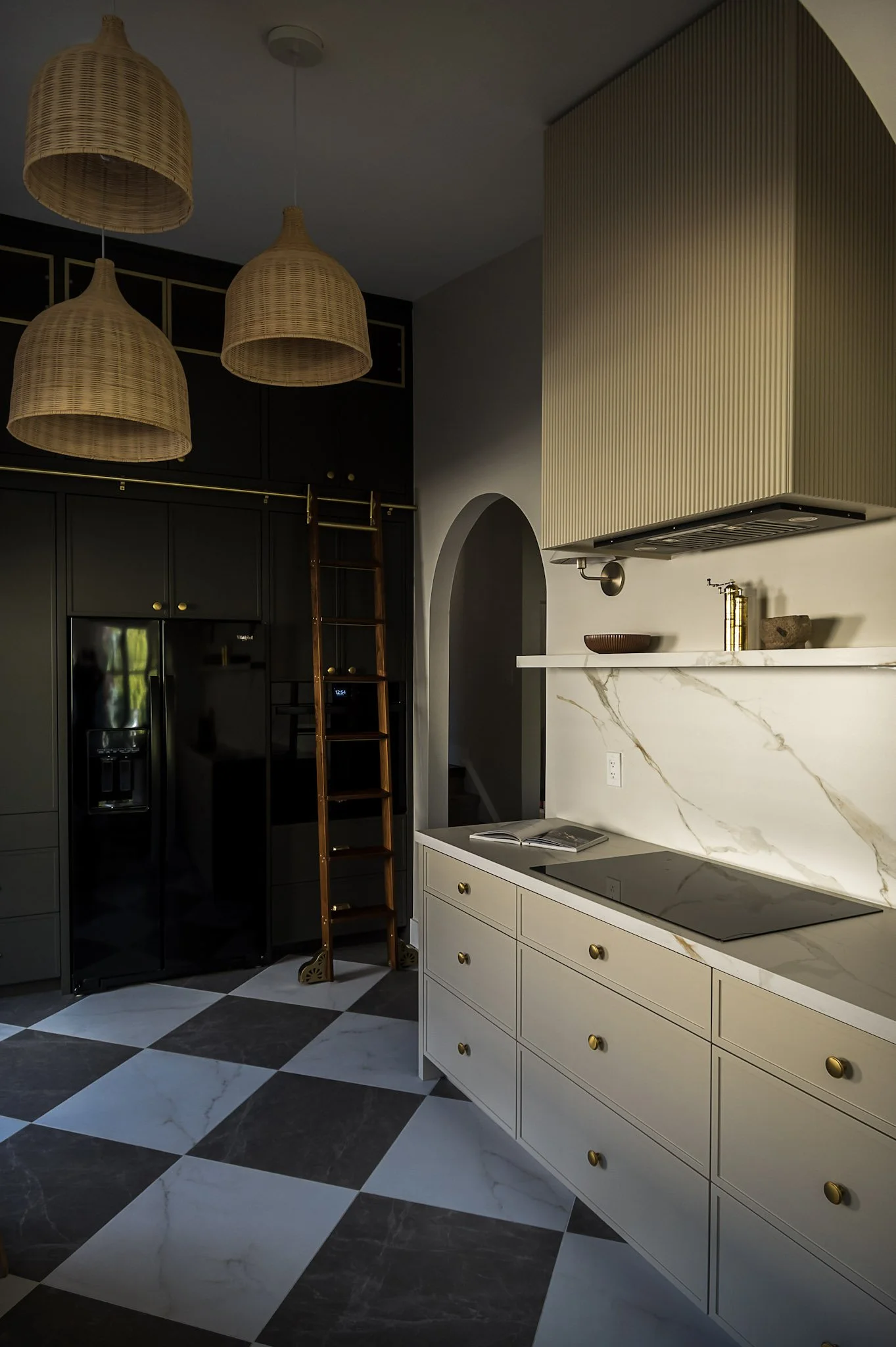 Kitchen with marble checkerboard flooring and library ladder interior design in Toronto Ontario by JT & Co Interiors