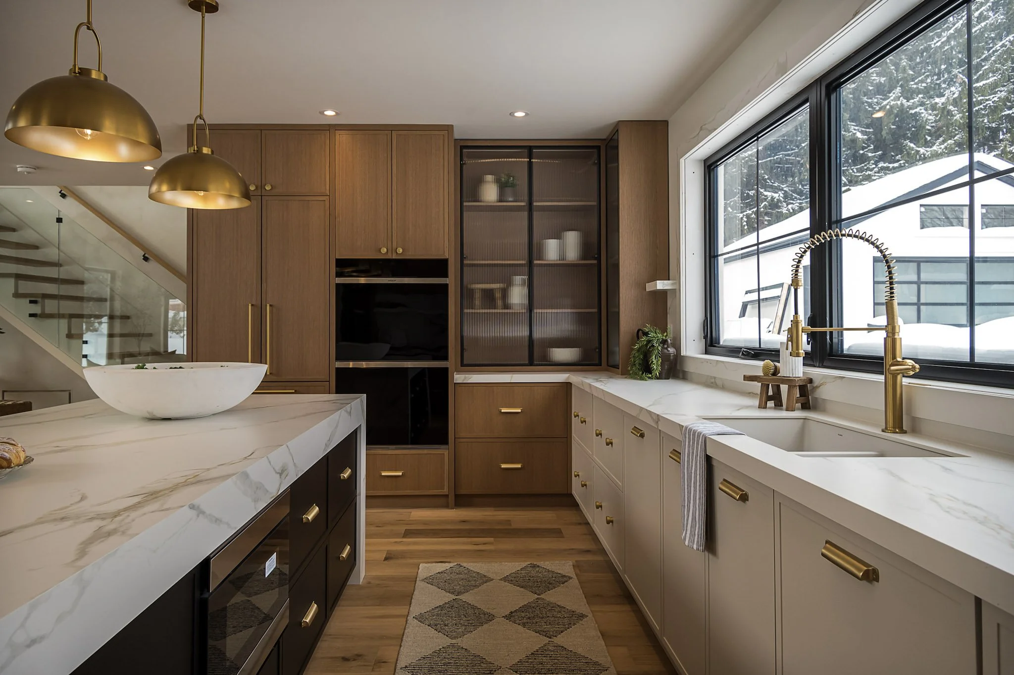 Kitchen with custom cabinetry and brass hardware interior design in Toronto Ontario by JT & Co Interiors