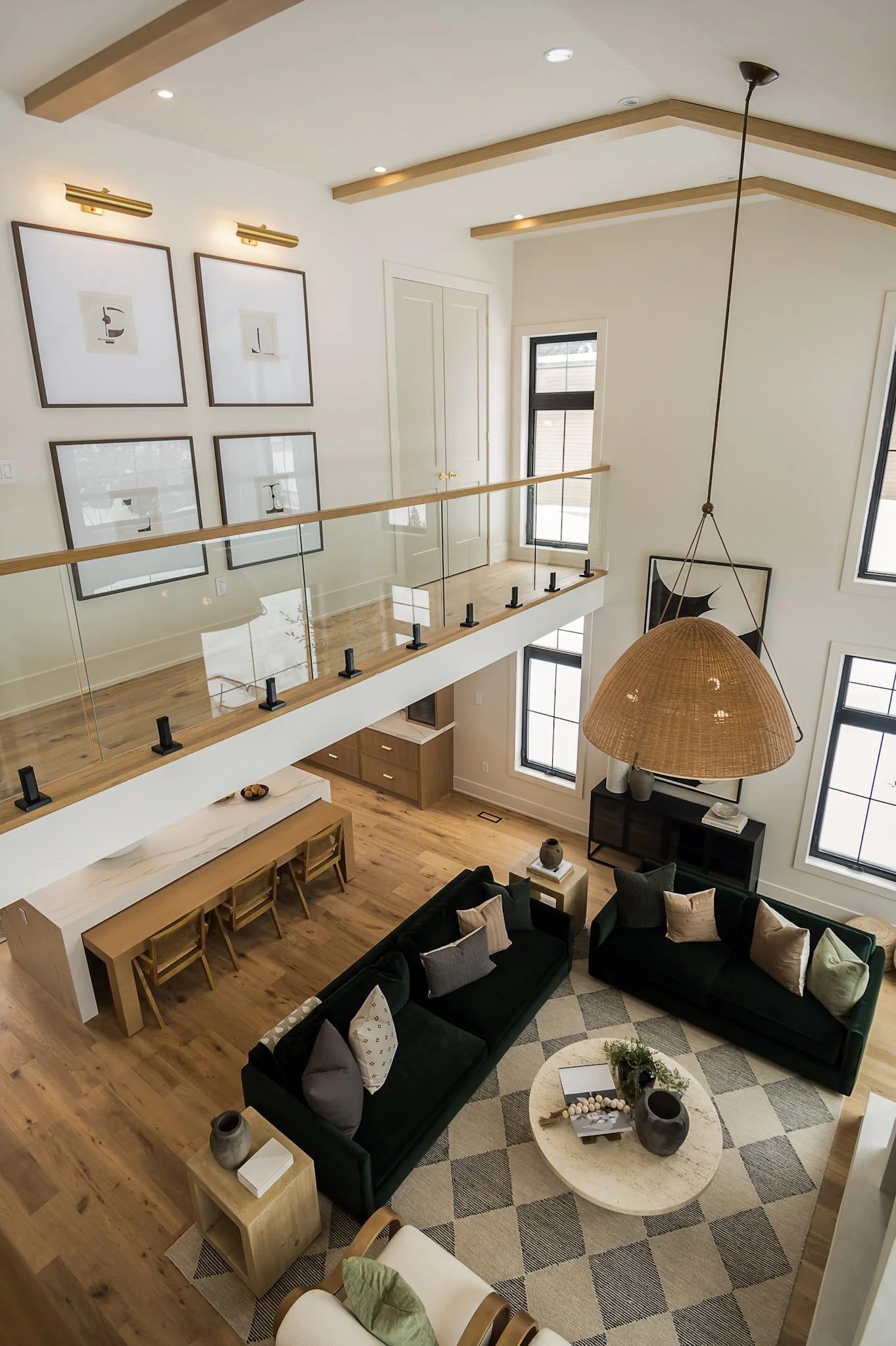 Living room with open concept layout and wood ceiling beams interior design in Oakville Ontario by JT & Co Interiors