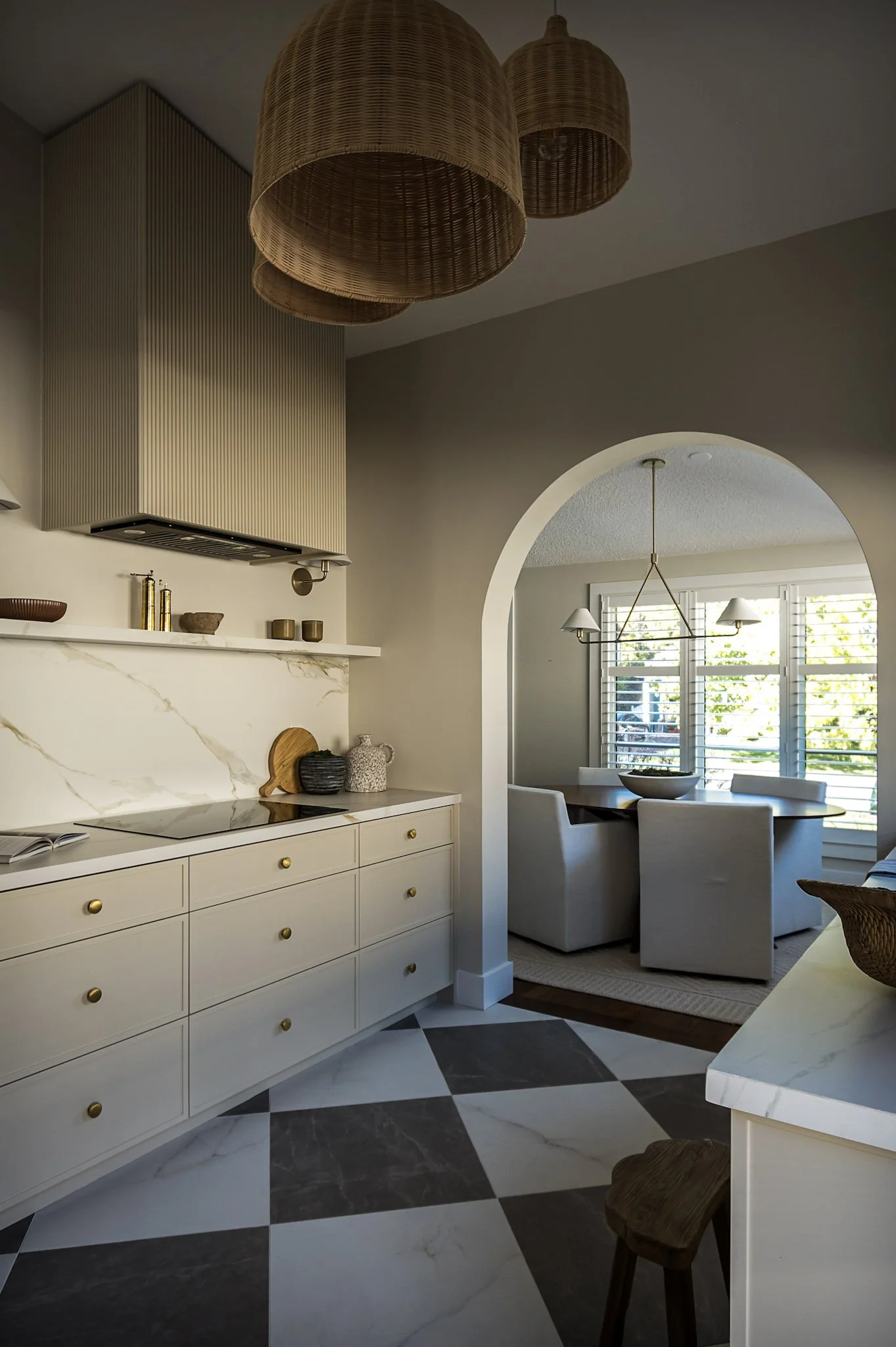 Kitchen with arched opening and marble checkerboard flooring interior design in Toronto Ontario by JT & Co Interiors