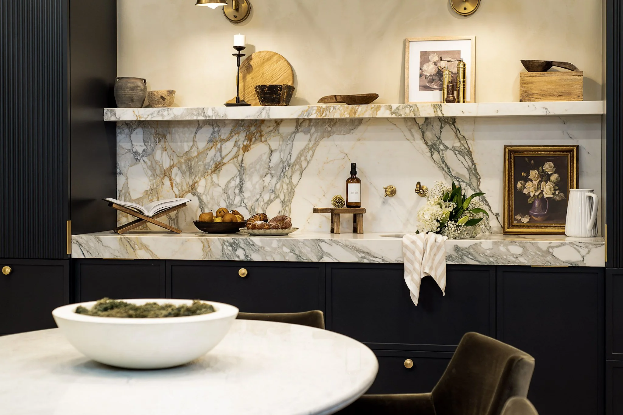 Kitchen with full-height marble and integrated shelving interior design in Toronto Ontario by JT & Co Interiors