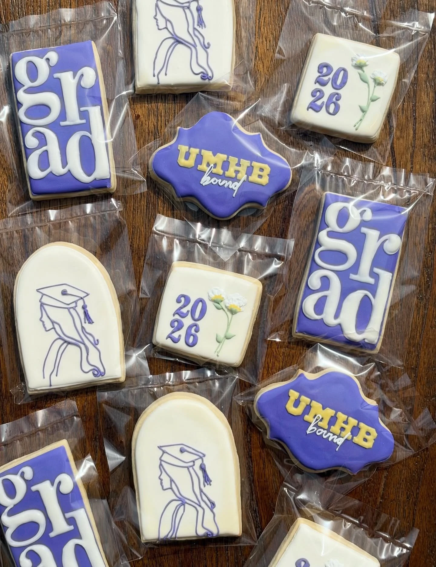High school grad cookies! Perfect for a gift or graduation party 🎓🤍

1 dozen includes 4 shapes (3-4.5&rdquo;), design of choice, school or work &ldquo;bound&rdquo;, and unlimited colors.* $50 a dozen. 

*all cookies are individually wrapped and hea