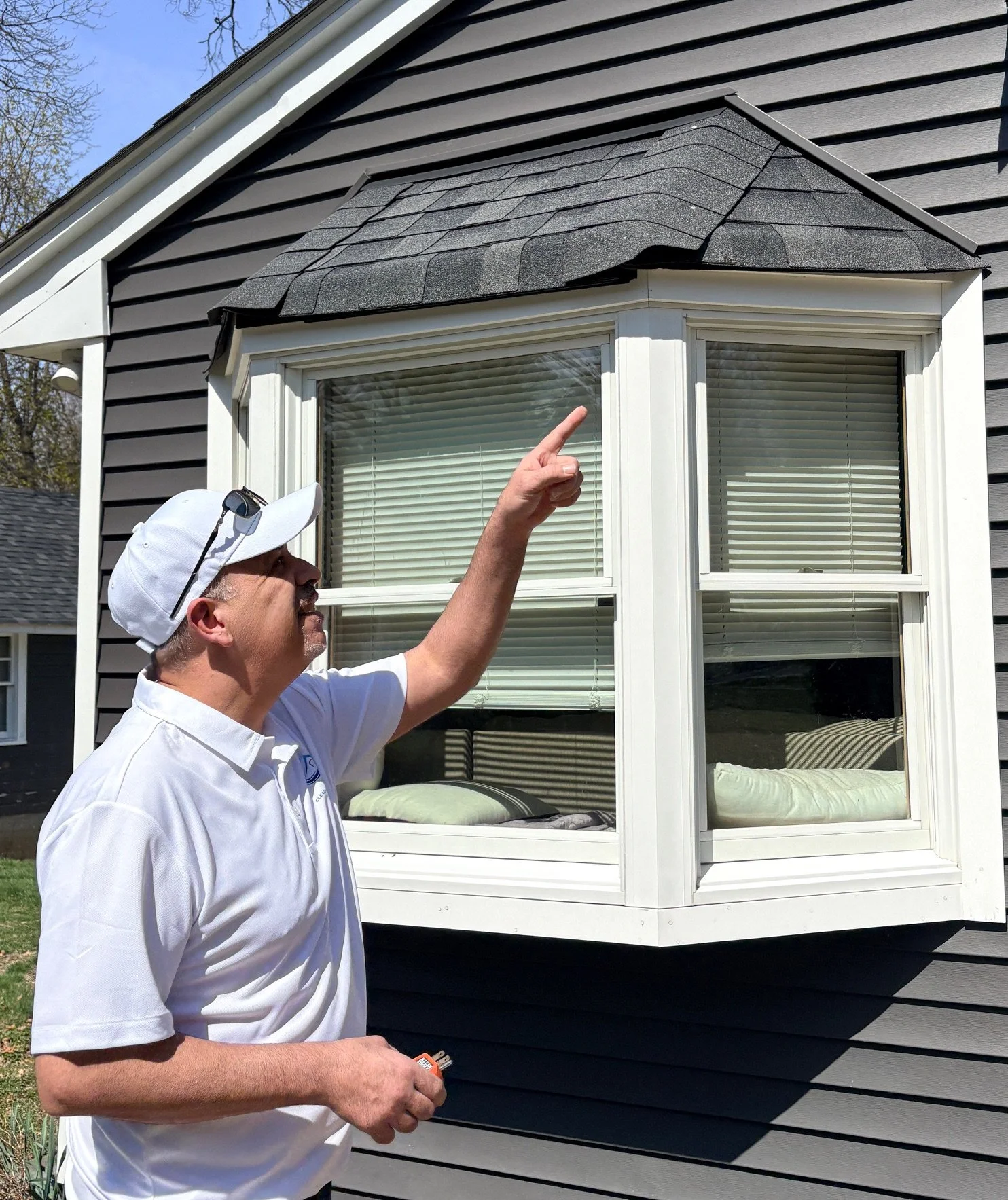Home inspector examining the exterior of a house