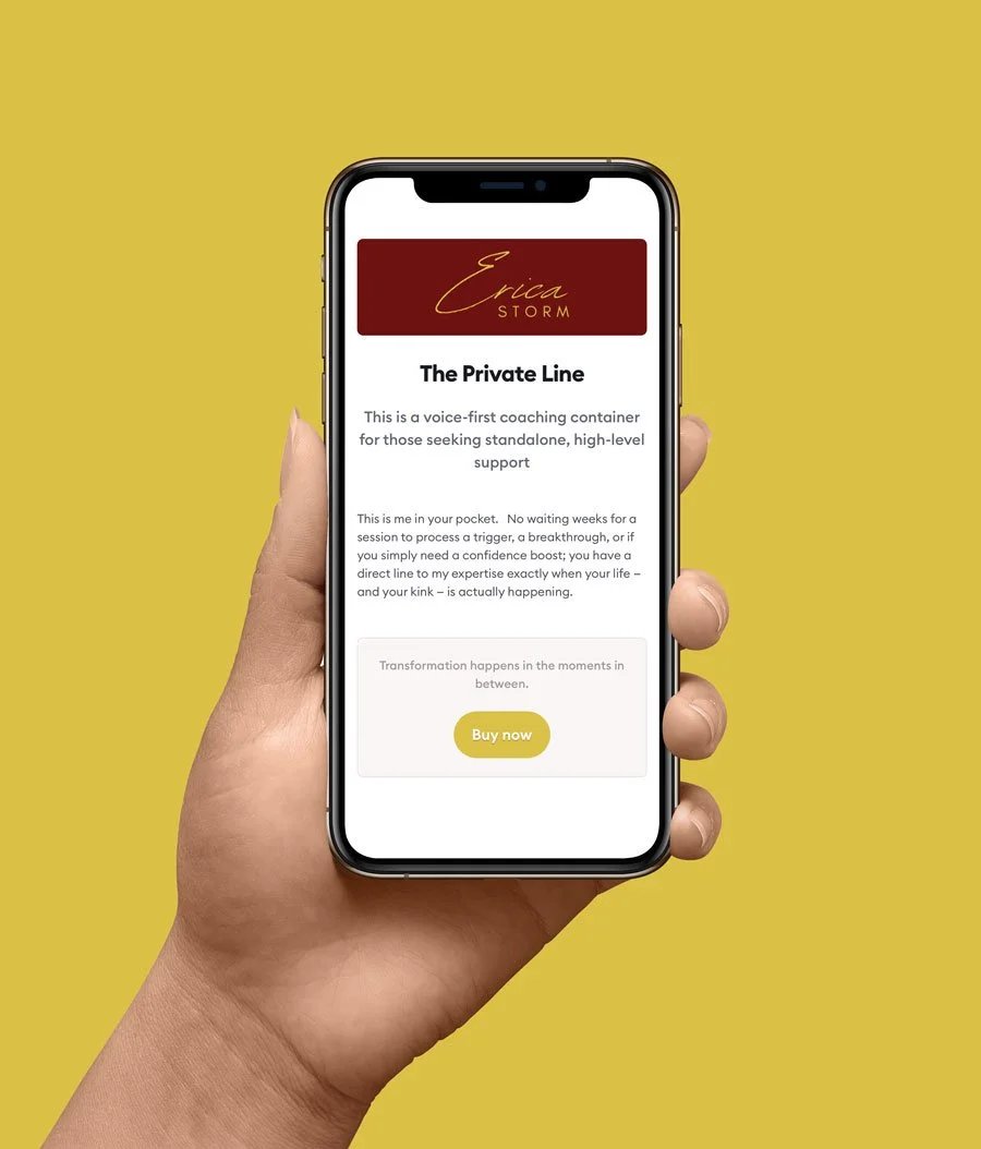 A person holding a smartphone displaying a coaching service called Erica Storm's 'The Private Line' on a yellow background.