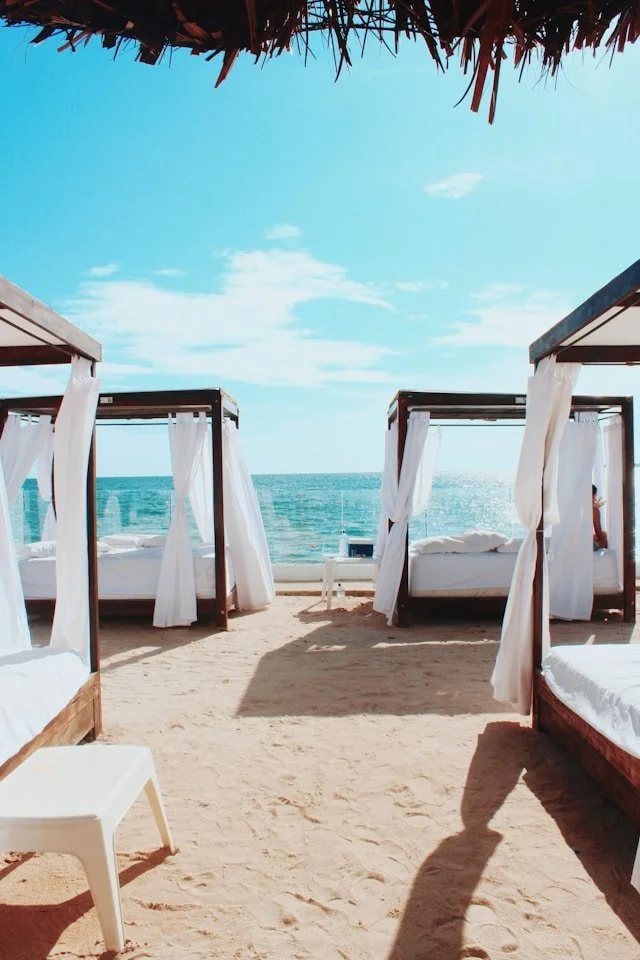 Beachfront cabana and lounge chairs at a resort
