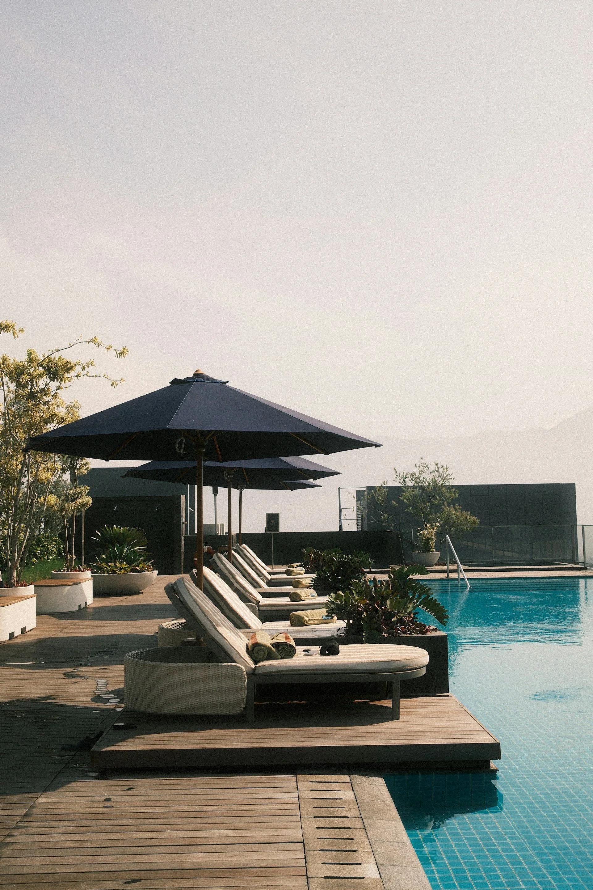 Poolside loungers and umbrellas at an all-inclusive resort