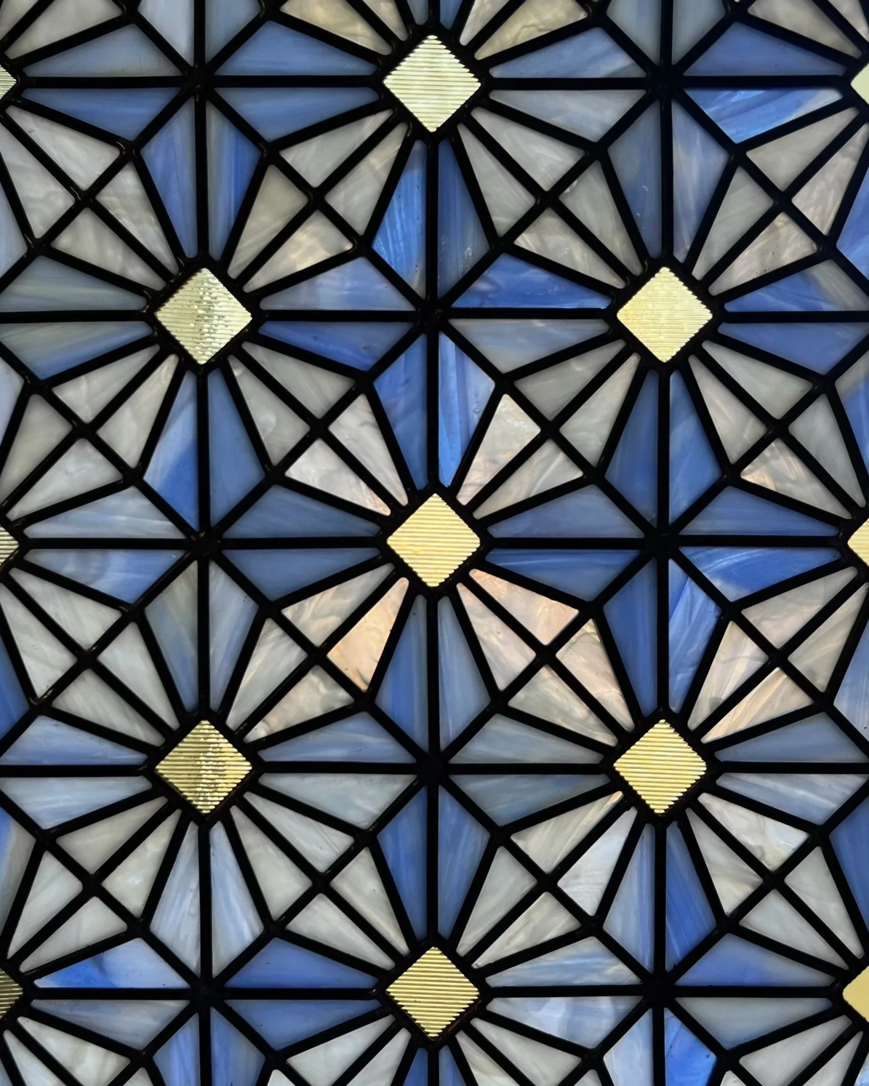 Blue and White Geometric Stained Glass Window