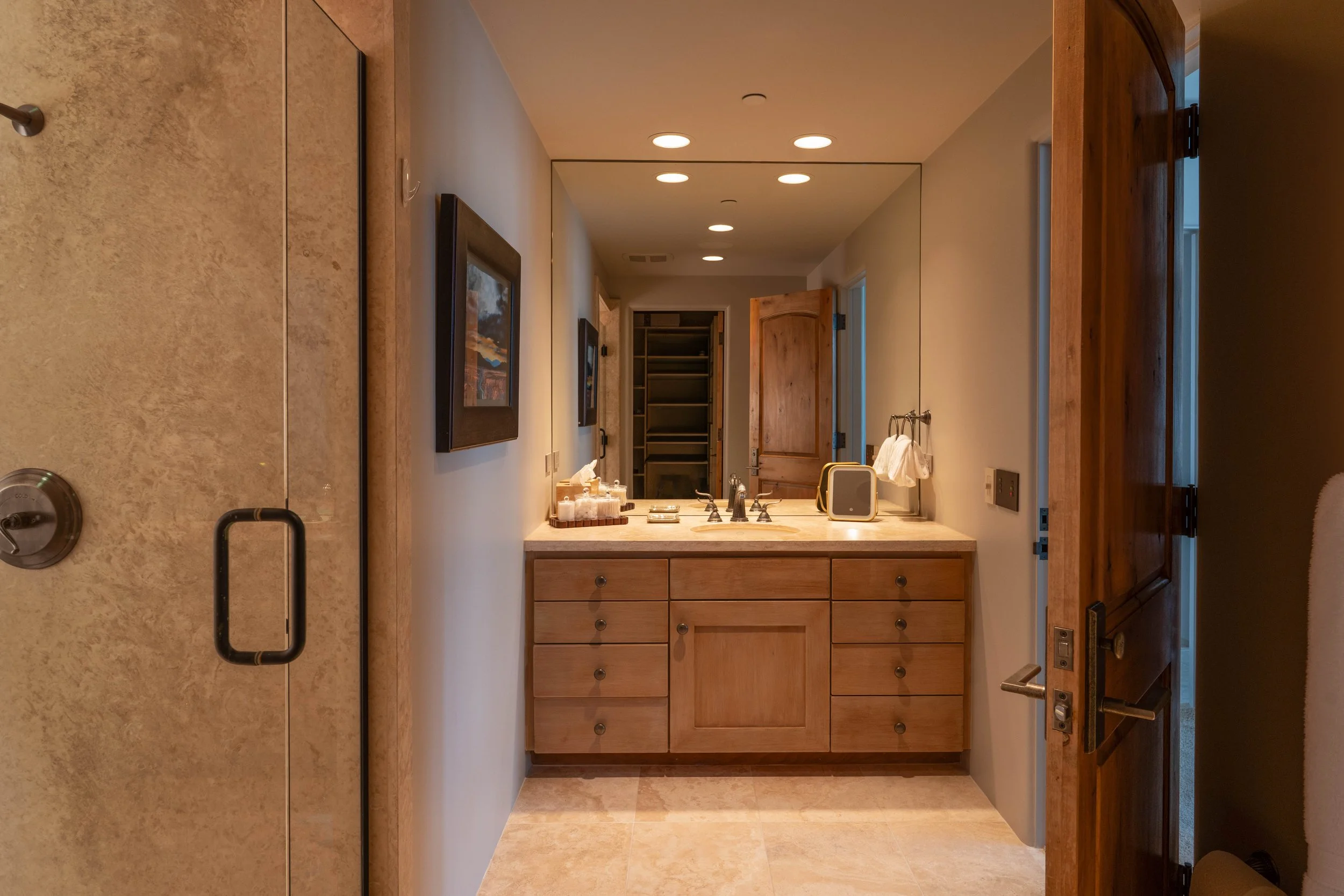 Bathroom of downstairs bedroom #2. Walk-in (left) shower and walk-in closet (behind).