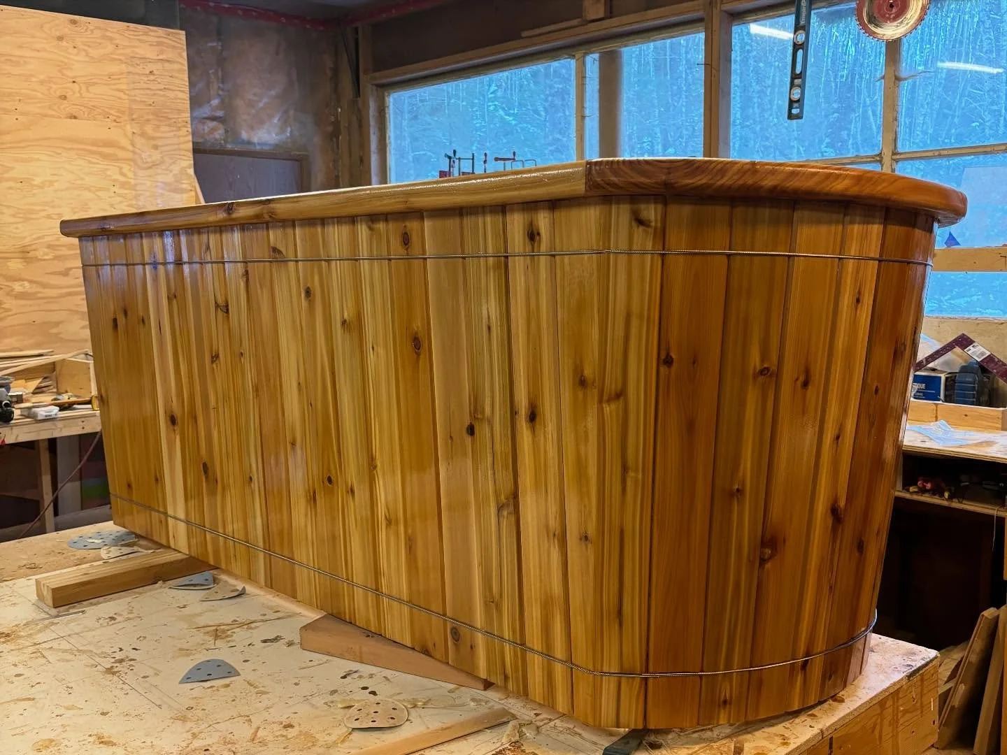 Custom cedar cold plunge with a smooth rounded profile and warm natural finish.