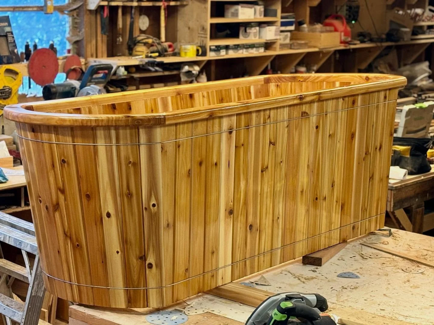 Custom cedar cold plunge with a smooth rounded profile and warm natural finish.