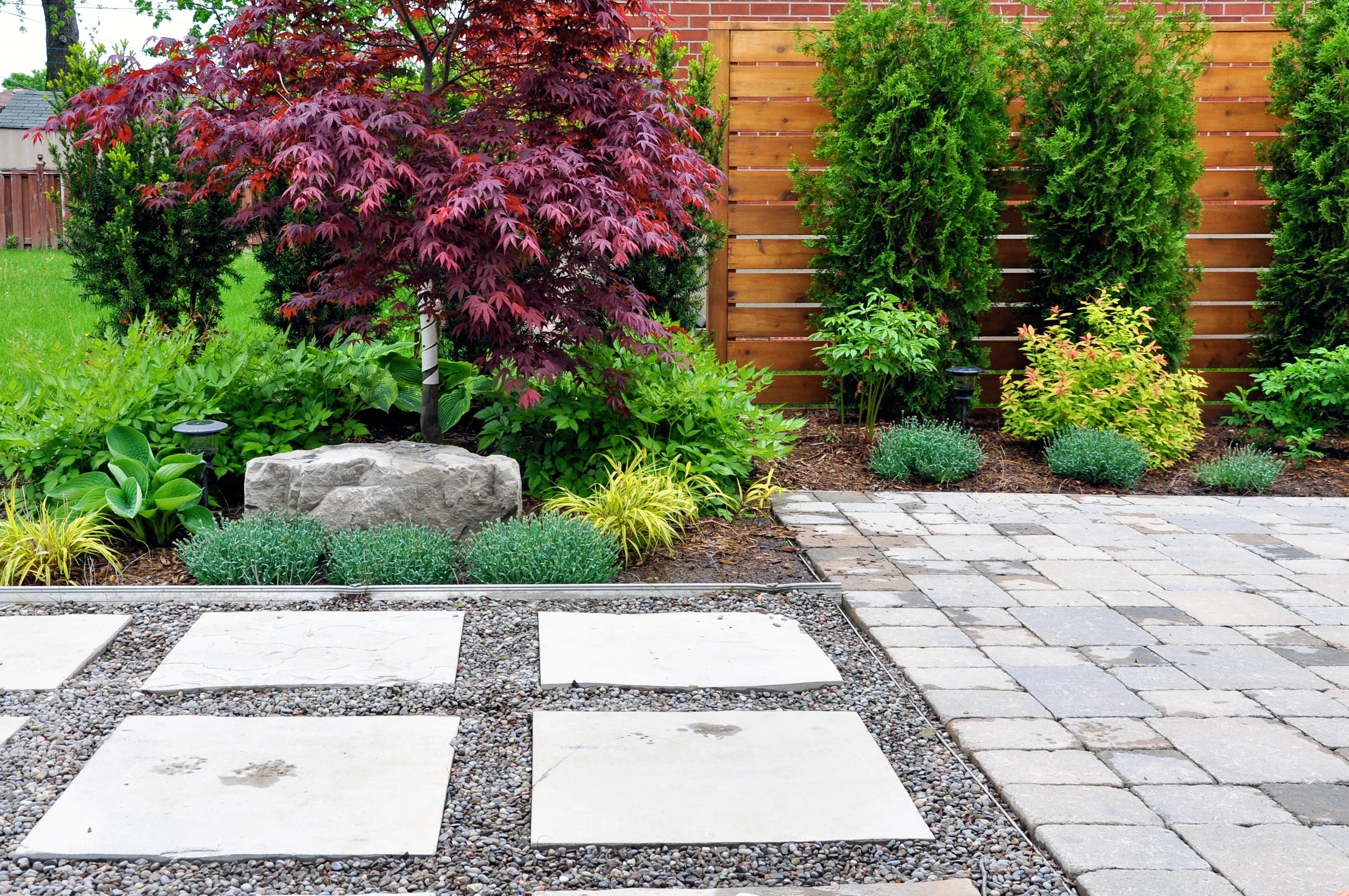 Backyard, designs, and flower bed and Hardscape install in Windsor Ontario by NB lawn and landscape