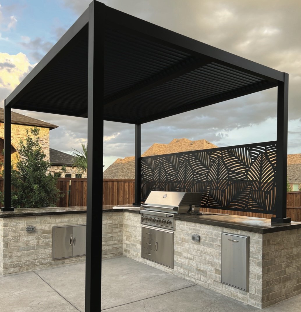 pergola with decorative privacy screen over outdoor kitchen