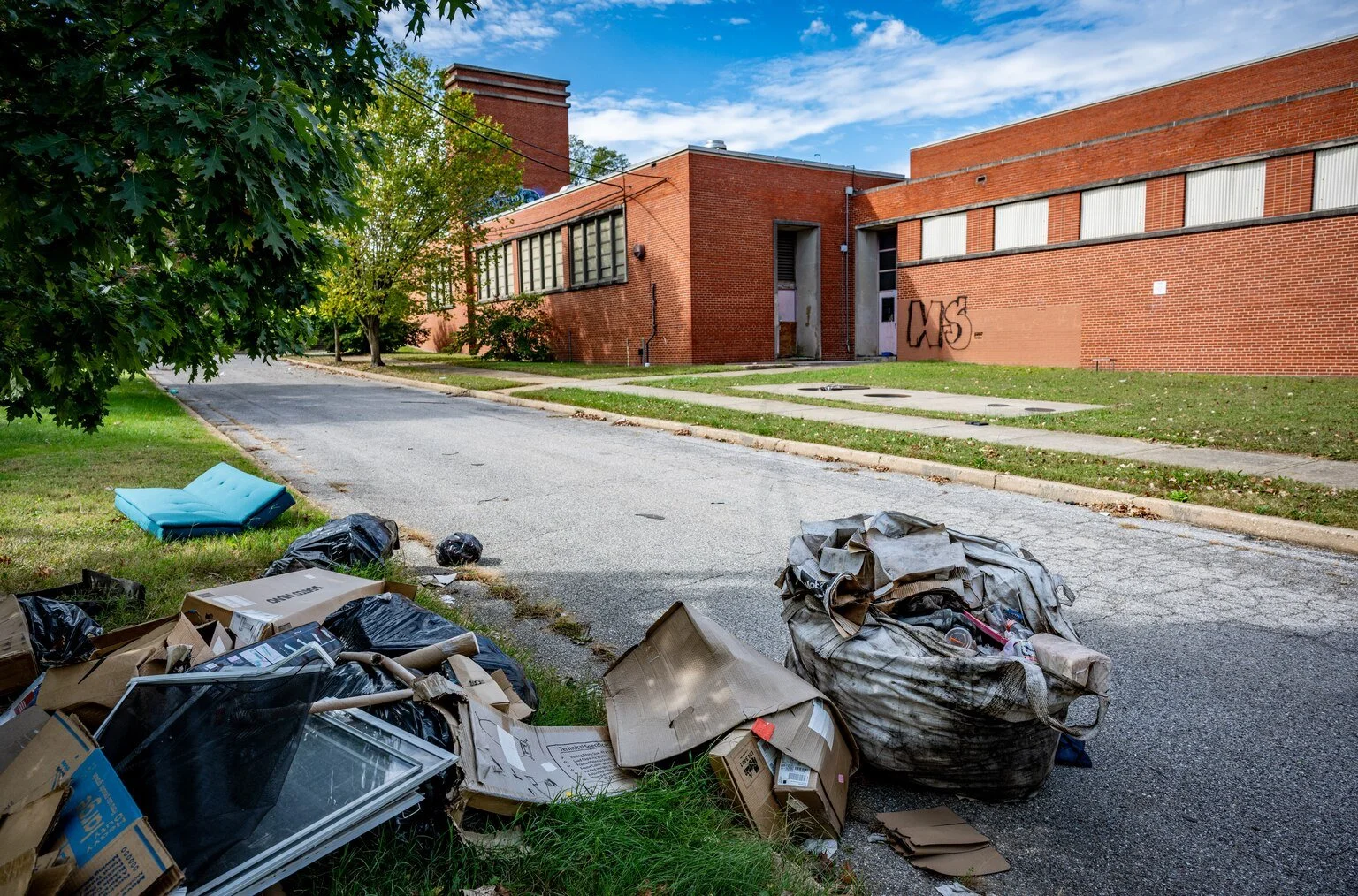 South Baltimore’s closed schools are prime real estate. For now, they’re full of trash.
