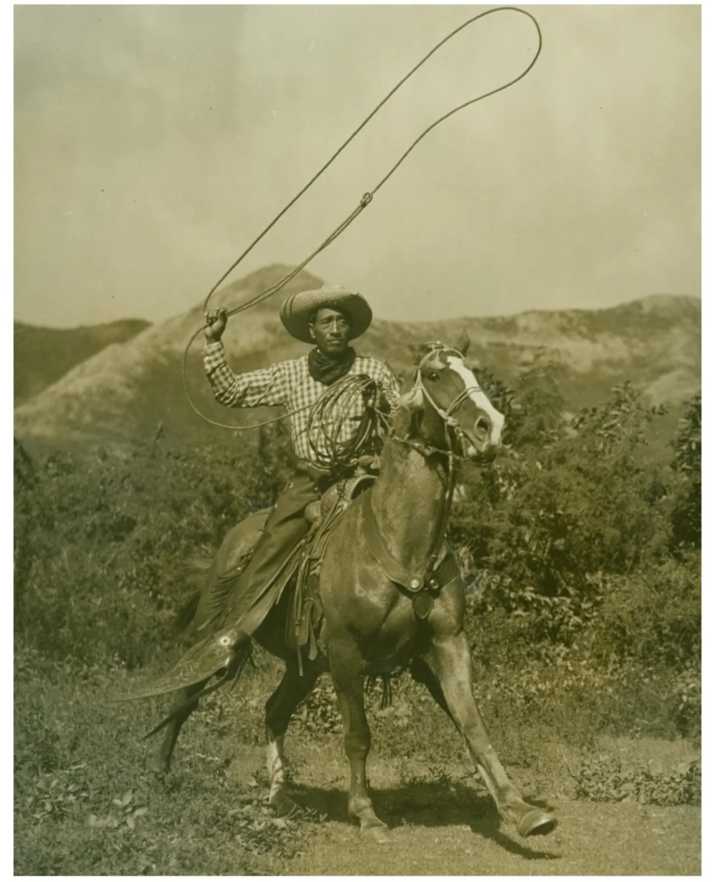 Paniolo David Kuloloia of Pu&rsquo;u o Hōkū Ranch with lasso; Kaunakakai, Moloka&rsquo;i, Hawaii, 1938. Photo by N. R. Farbman, Bishop Museum Archives, N. R. Farbman Collection. SP 119070.