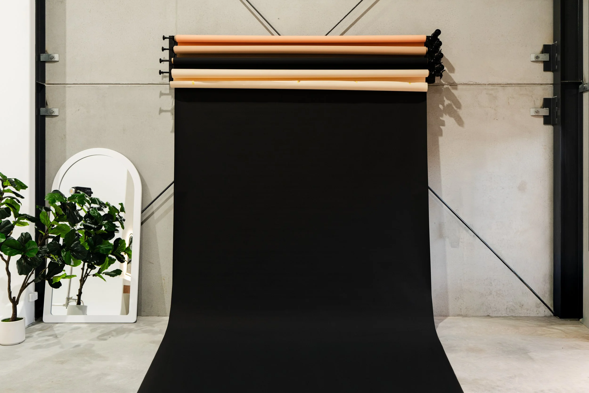 An array of paper roll backdrop options in a photography studio