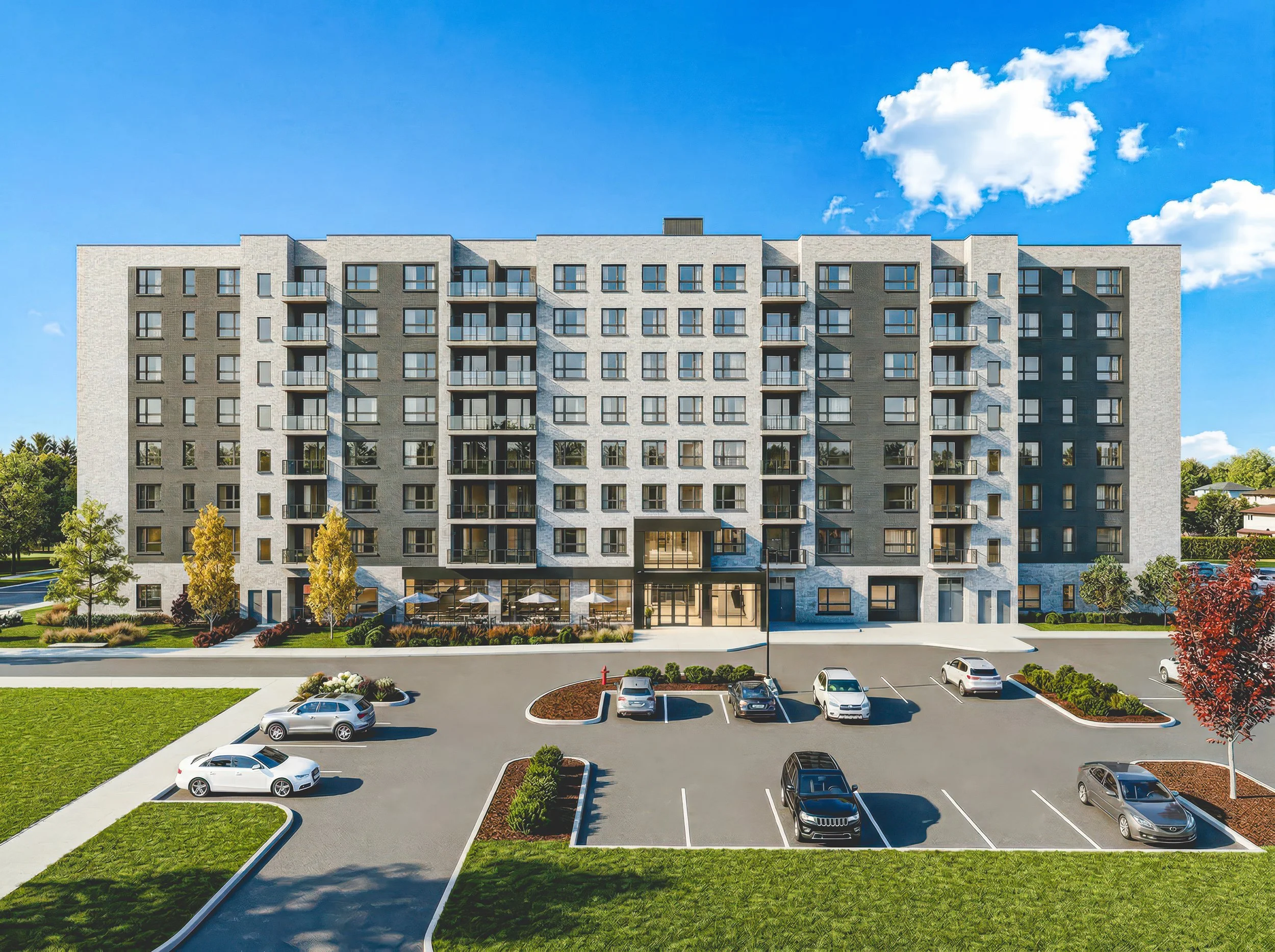 Multi-story residential apartment building with a parking lot in front, surrounded by trees and lawns, under a partly cloudy blue sky.