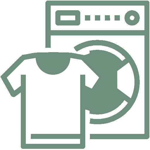 Clothes being washed in a washing machine with a T-shirt inside.