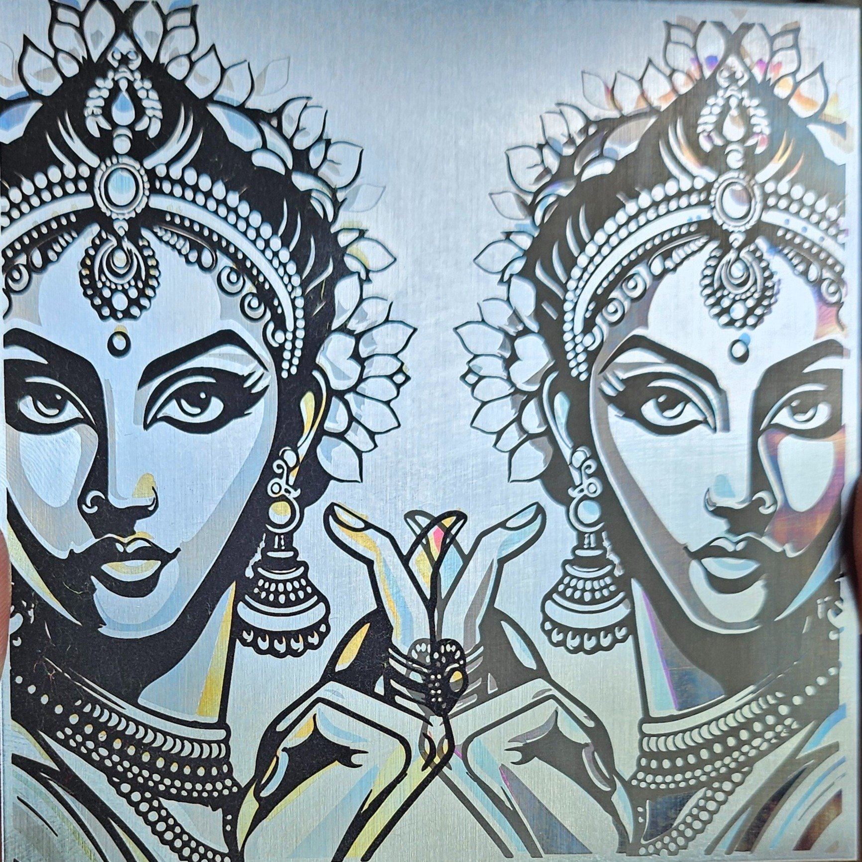 Testing out some intricate artwork on stainless steel using the xTool UV laser, and the results are absolutely striking. The level of high-contrast detail, fine lines in the jewelry, and the smooth, dark marking against the metal canvas turned out in