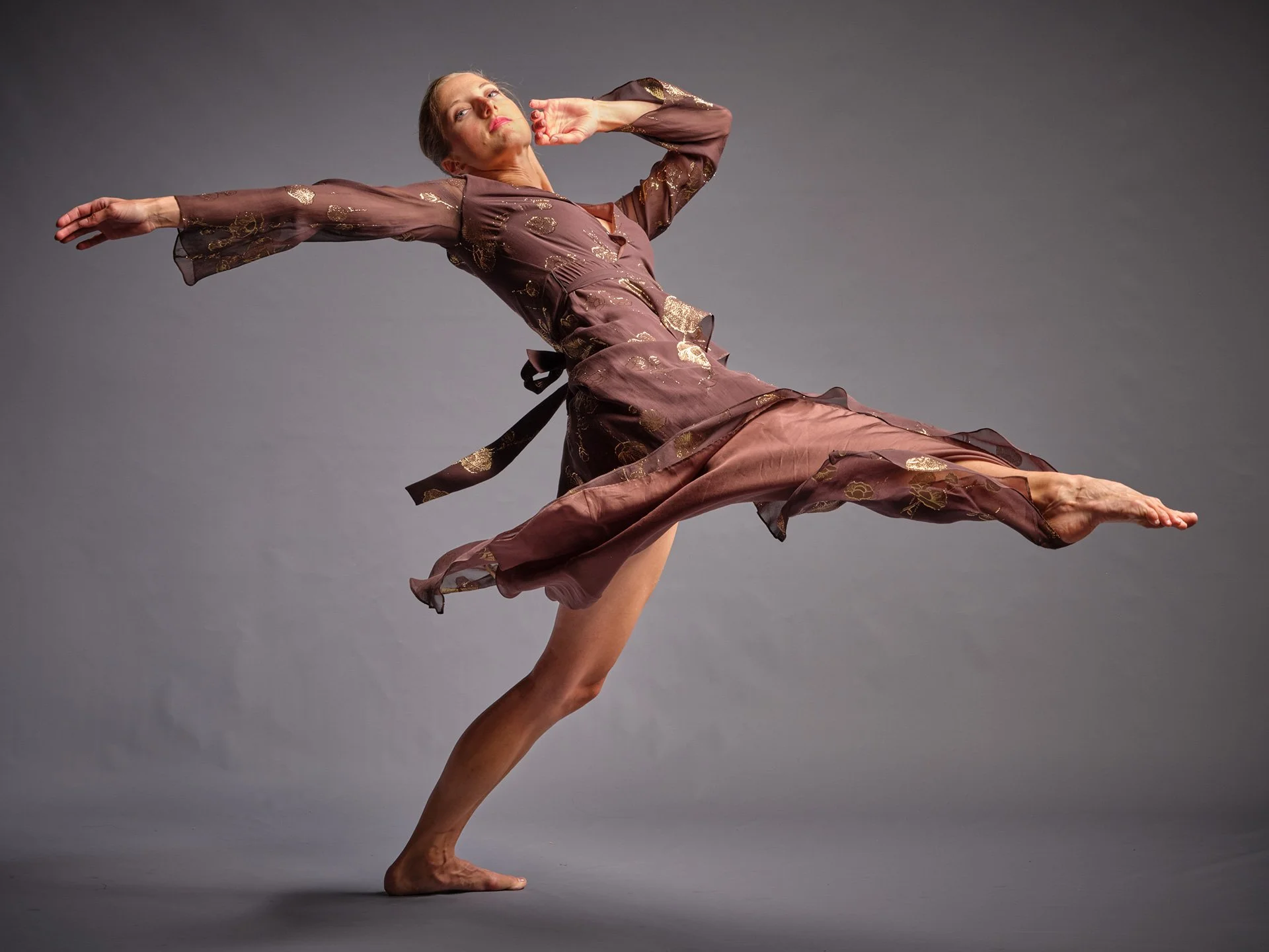 Michaela Ellingson in a dance pose leaning backward indicating flowy movement.