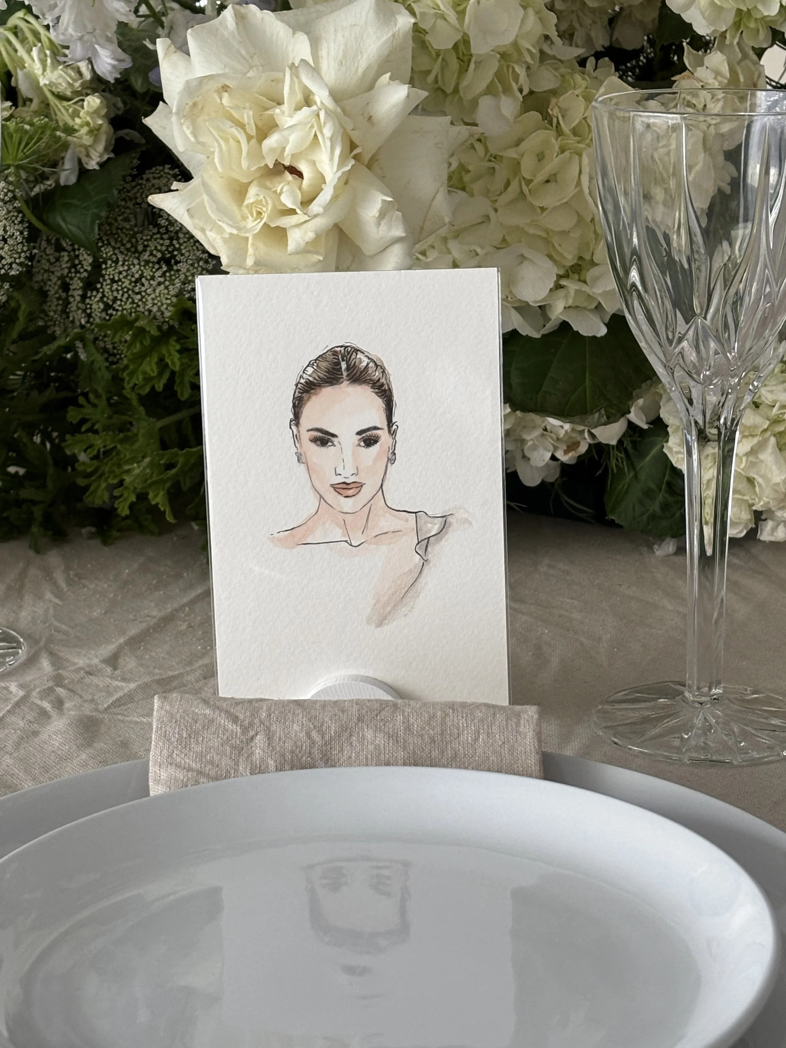 Face-focused wedding guest portrait displayed as a personalised keepsake at a table setting.
