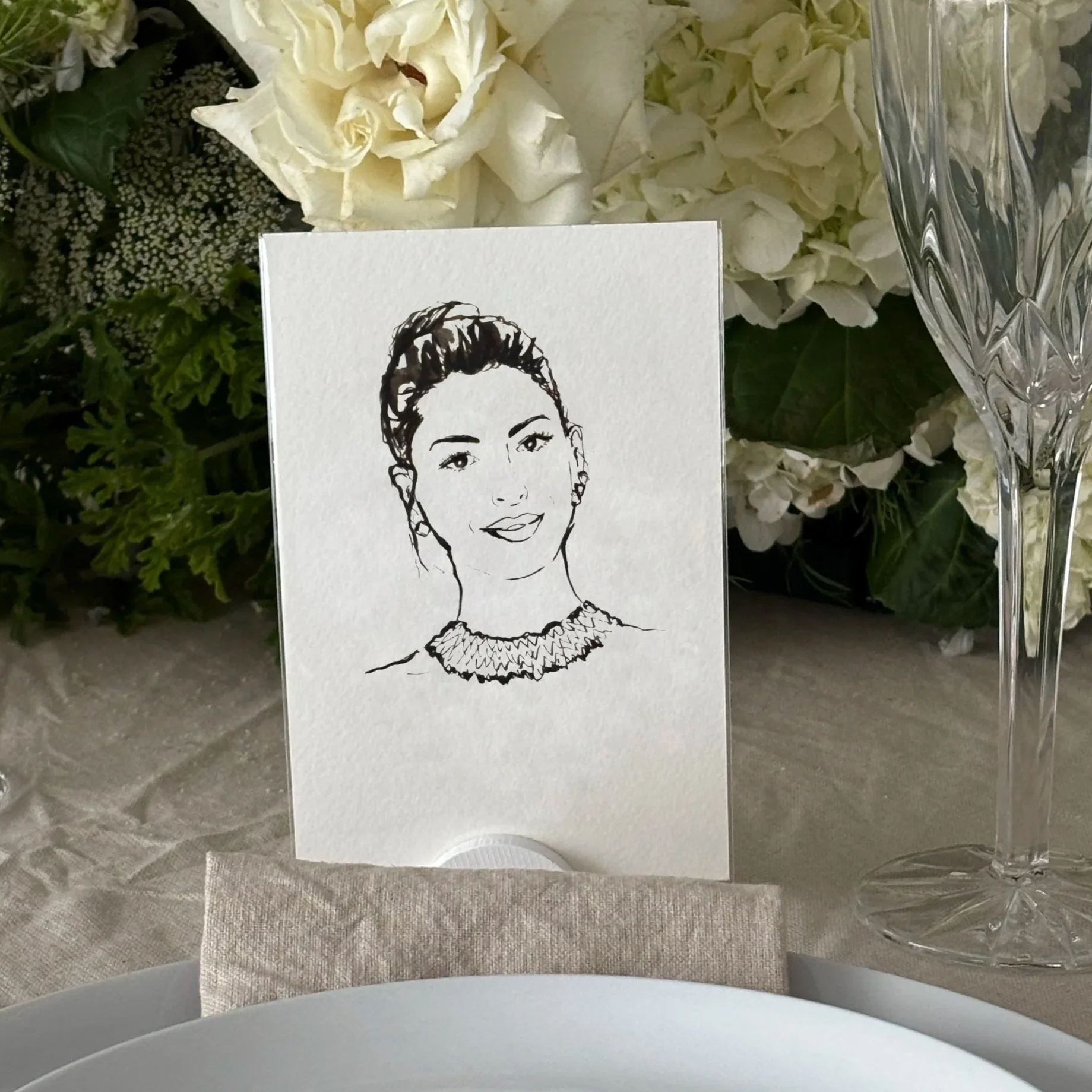 Hand-drawn guest portrait presented as an event place card and keepsake