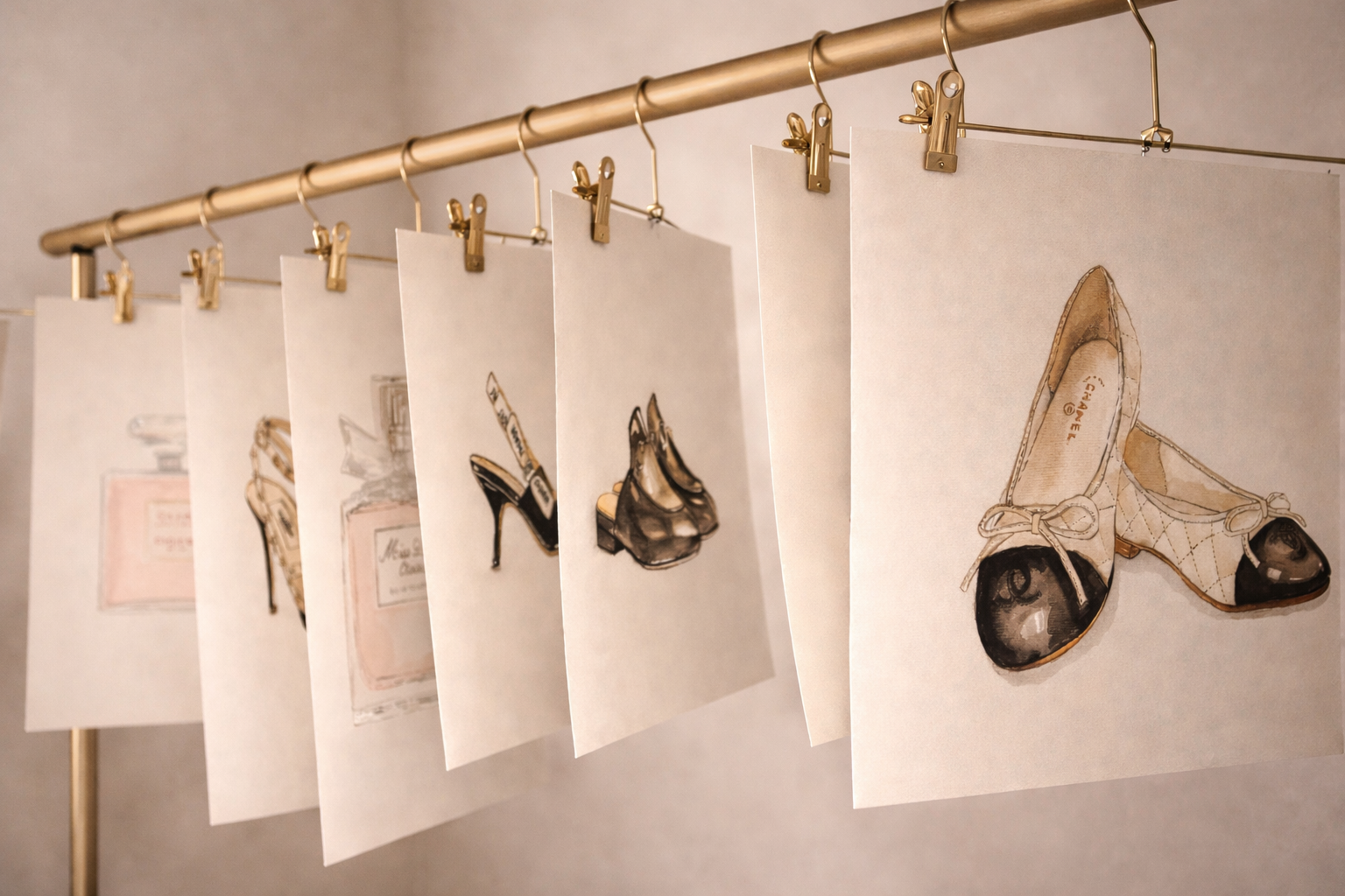 Fashion illustrations of shoes, accessories and fragrance displayed for a live brand activation.