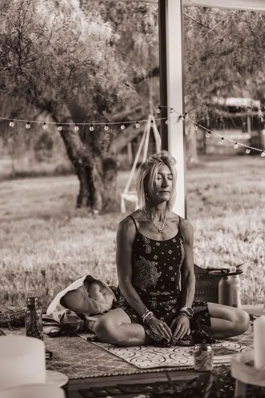 Black and white image of Liesl meditating