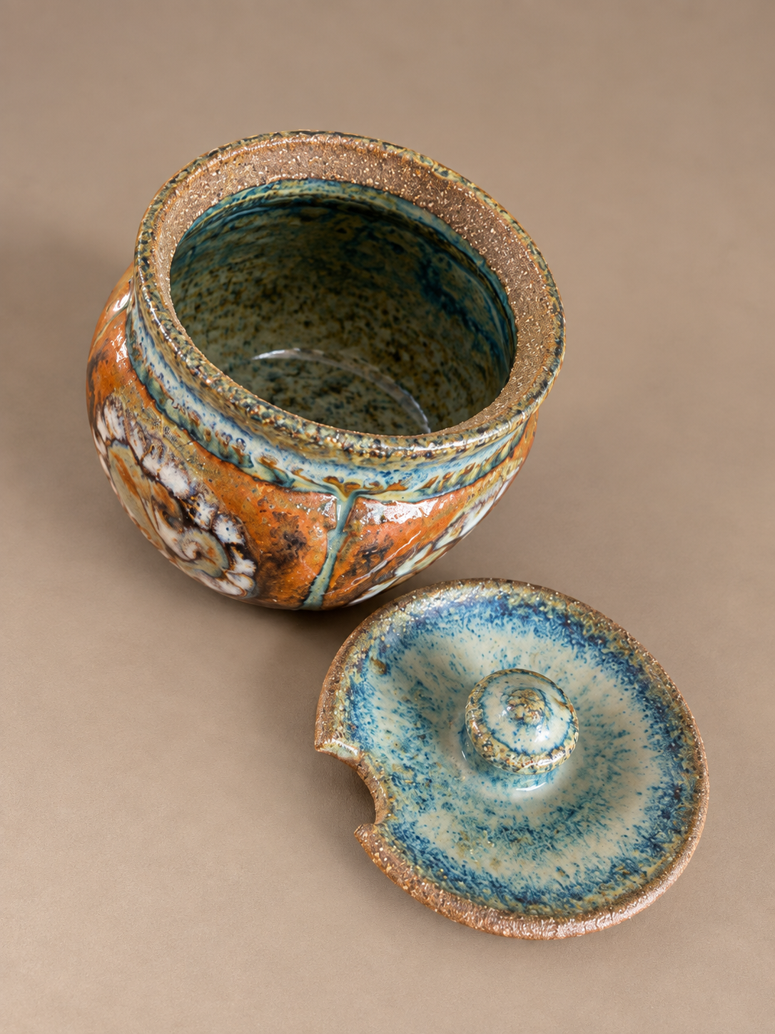 Rustic Glazed Ceramic Jar and Lid.png