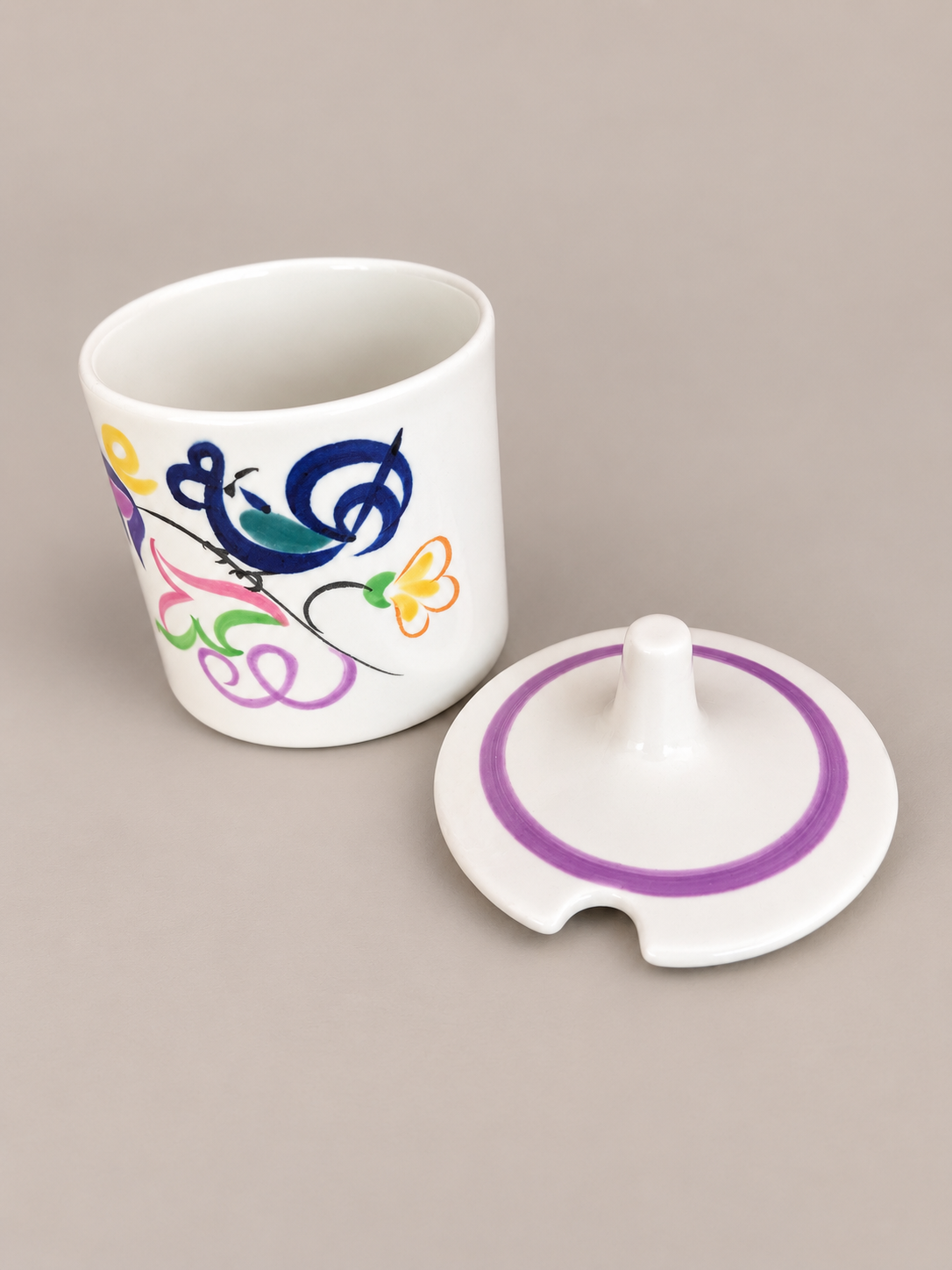 Whimsical Painted Ceramic Cup and Lid.png