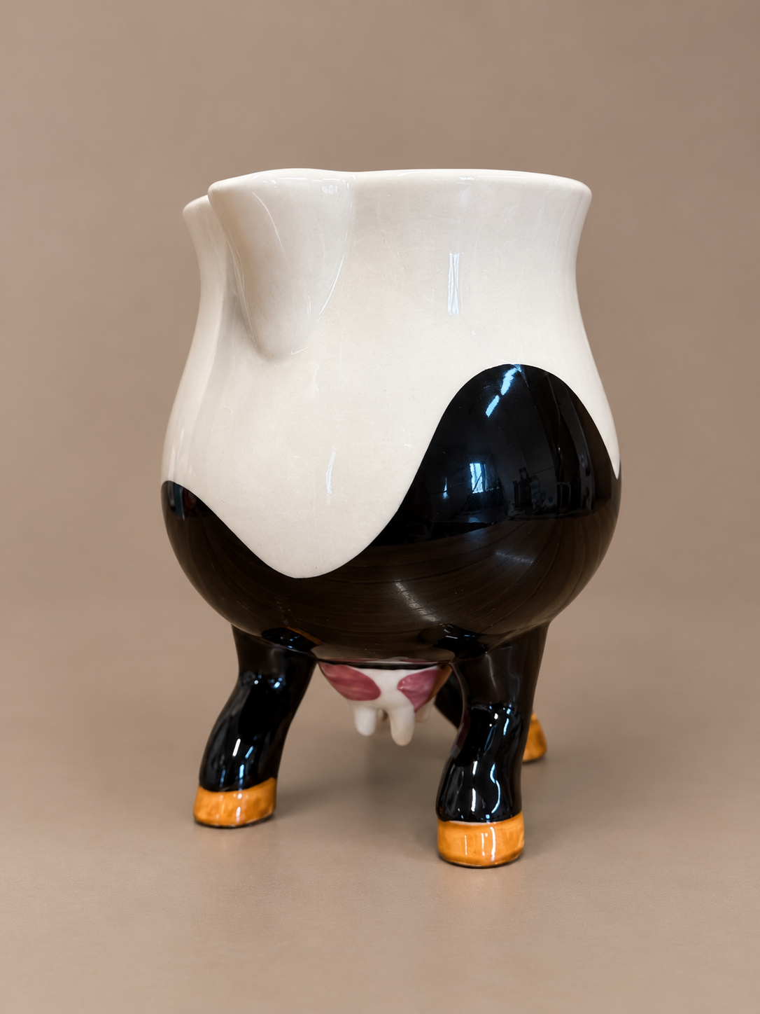 Cow-Shaped Ceramic Creamer on Hooves.png