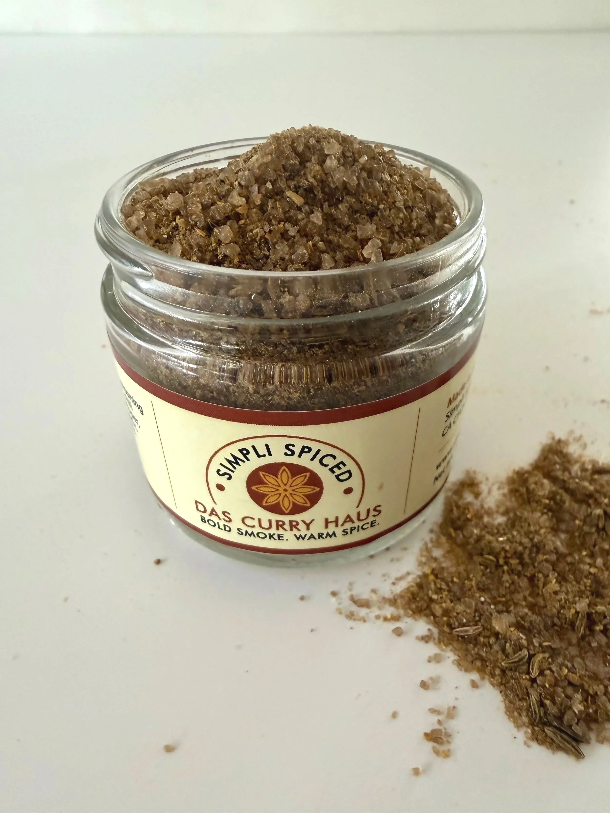 das+curry+haus+in+a+jar+with+salt+on+table.jpg