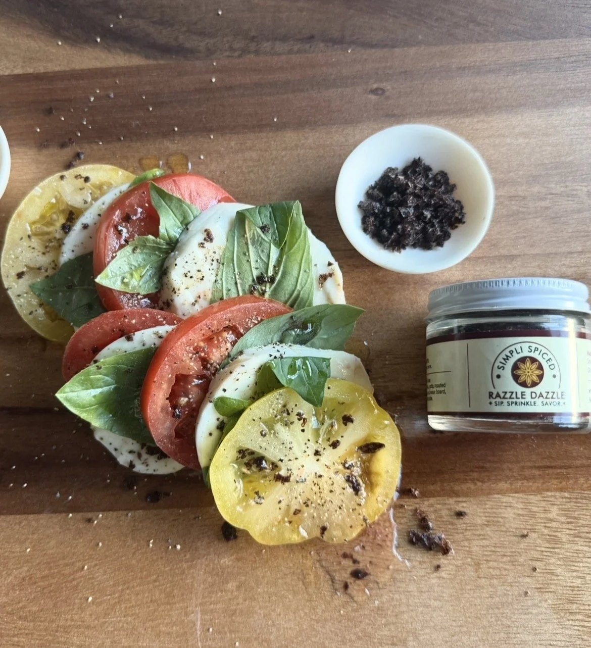 Caprese salad with tomatoes, mozzarella, basil, and red wine sea salt