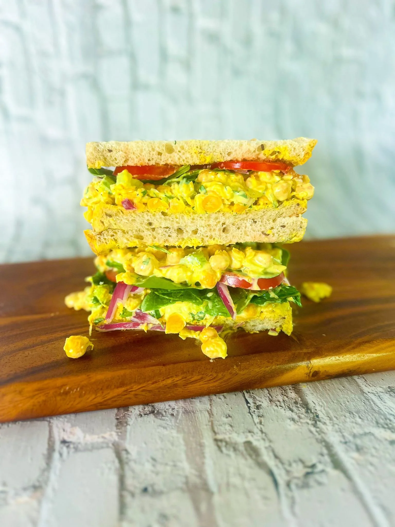 Curry chickpea salad sandwich with creamy spiced chickpeas on sliced bread