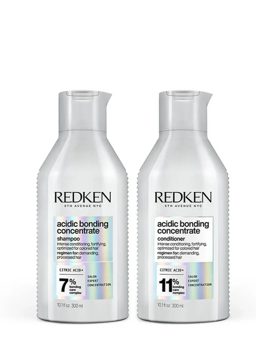 Two bottles of Redken acidic bonding concentrate shampoo and conditioner, 300ml each, with a white background.