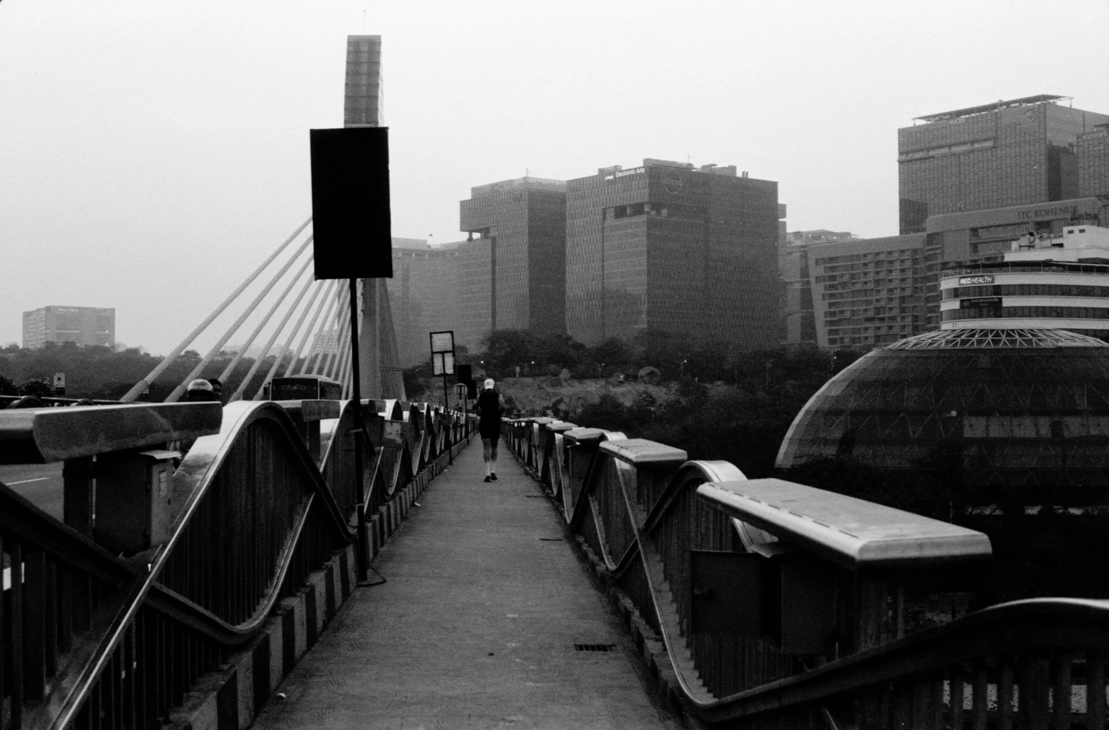 Man jogging on the Durgam Cheruvu bridge