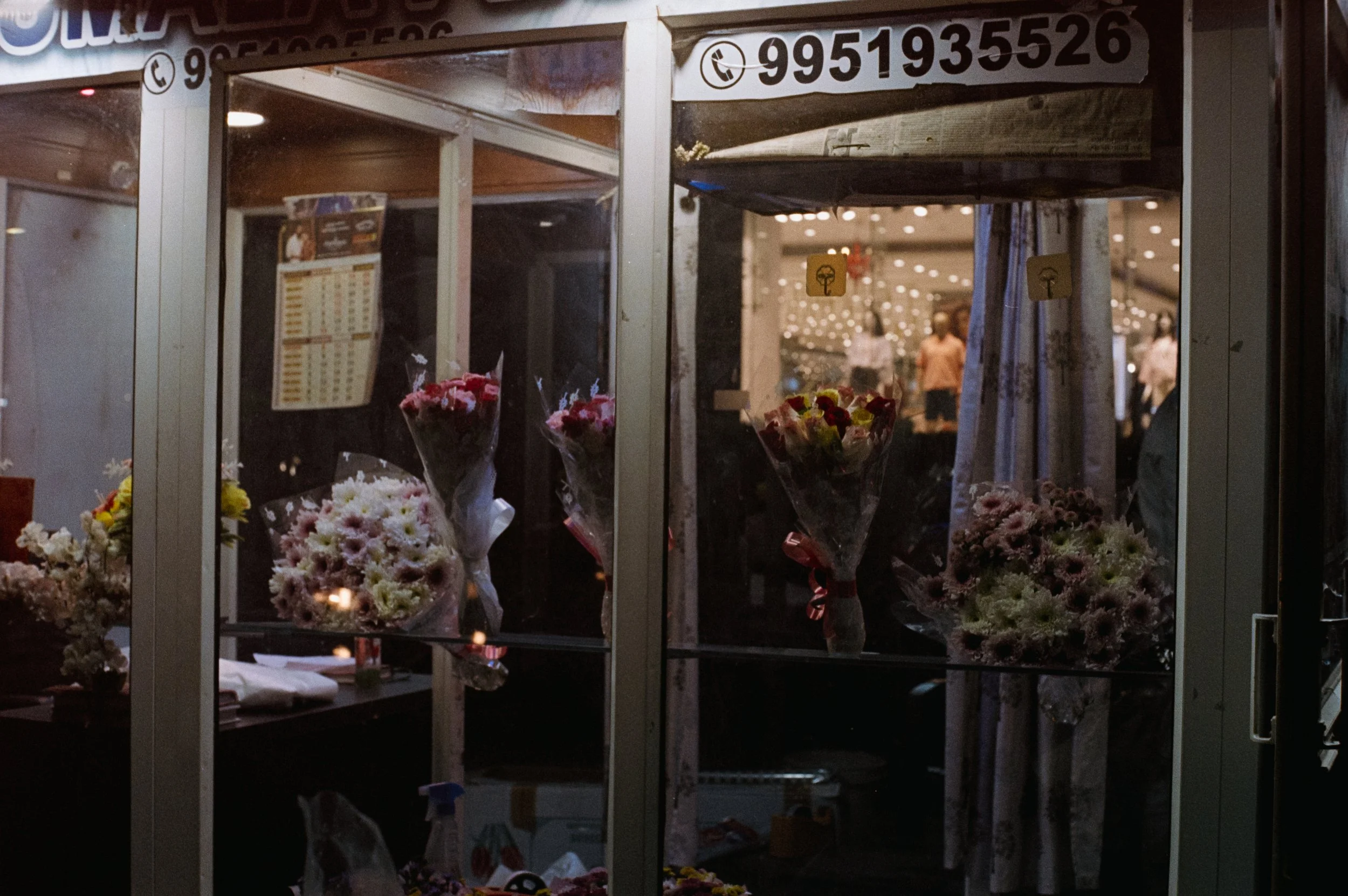 Flower Shop that seems to be in a remodified telephone booth.