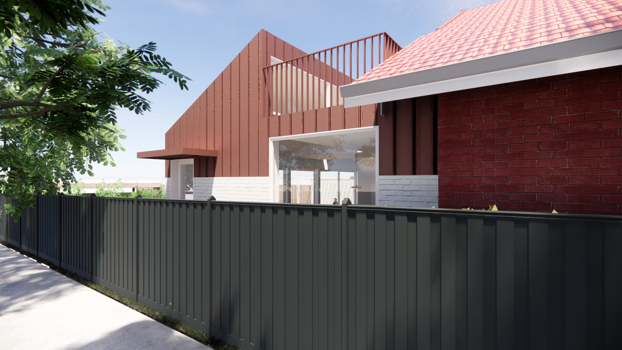 Modern house with a red metal siding exterior, white brick accent walls, large windows, and a black metal fence in front. Green trees are visible on the left side and the sky is blue with some clouds.