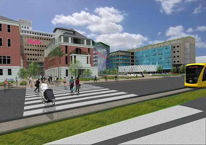 Illustration of a busy city street with pedestrians crossing a zebra crossing, a yellow bus, and a modern multi-story building complex including East Adelaide High School in the background.