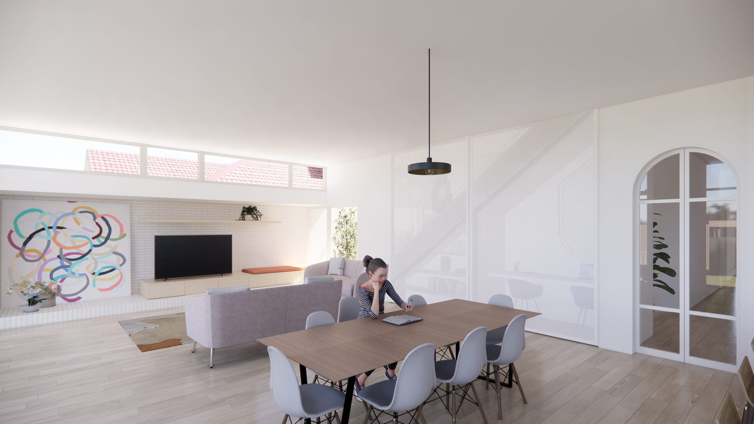 Modern living room with a dining area, large windows, a sofa, a television, and a woman sitting at the dining table reading a book.