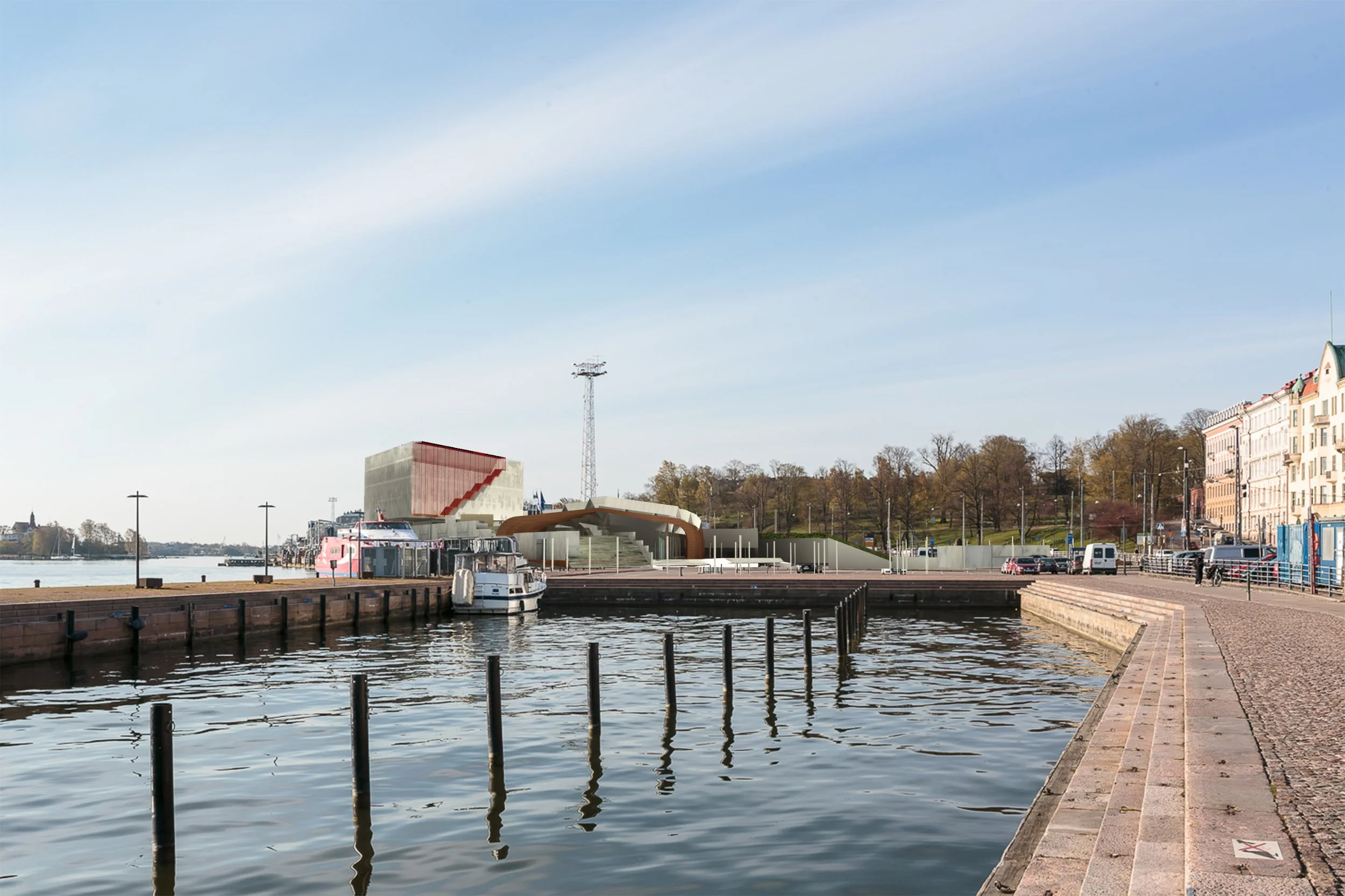 A waterfront scene with boats docked along a pier, modern buildings, and a clear partly cloudy sky with some trees and a hill in the background.