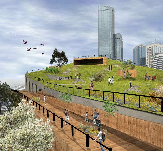 A terraced green rooftop park with walking paths, people sitting and strolling, surrounded by city skyscrapers, with birds flying in the sky.