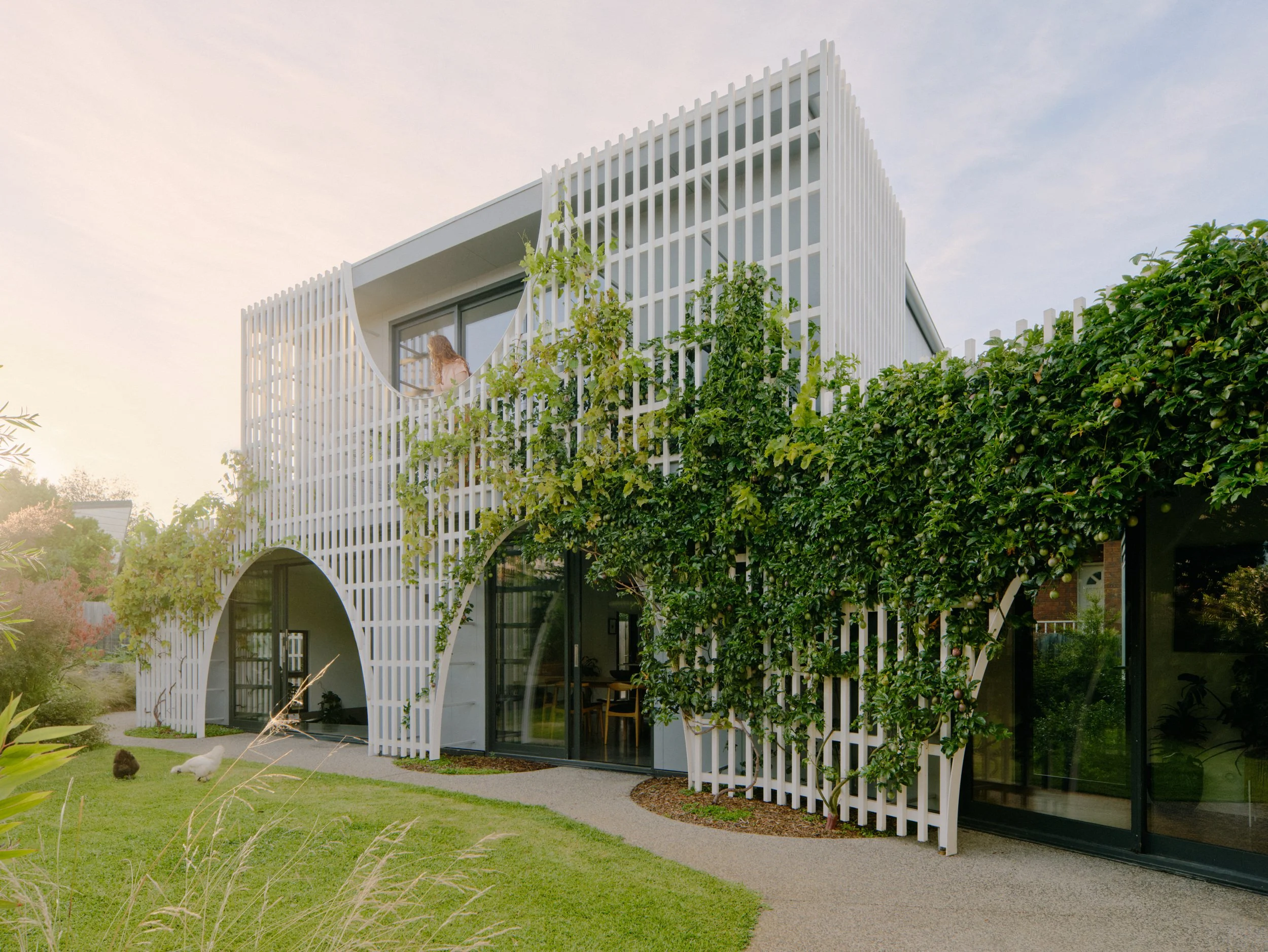 Award-winning and Design Files featured two-storey extension to the rear of a house in Reservoir is wrapped in a large timber screen.