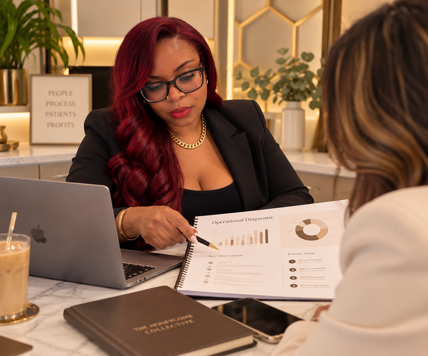 Businesswoman with red hair and glasses discussing operational diagnostic report with another person in an office setting.