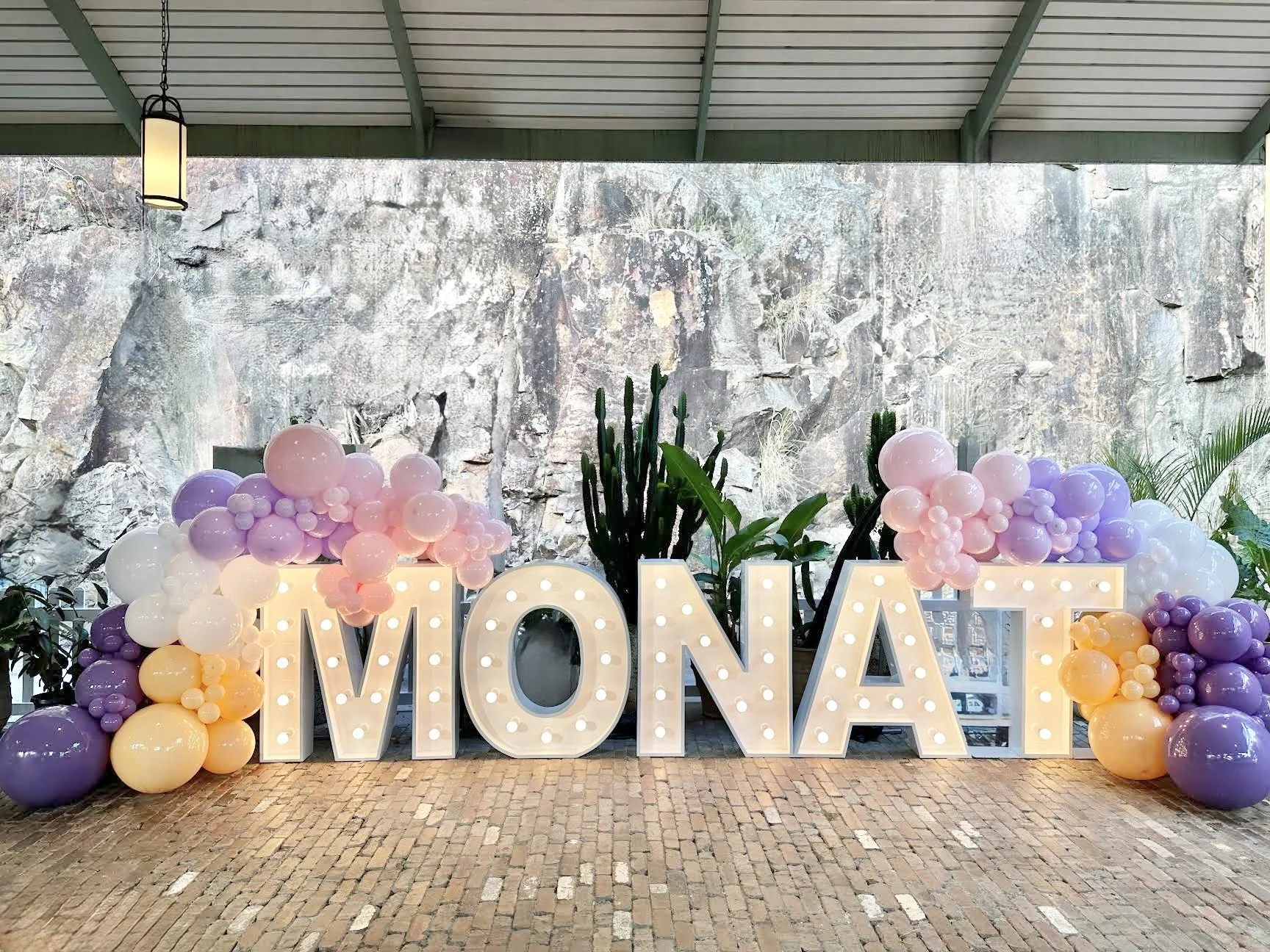 Balloon wall and light up letters for a corporate event for MONAT