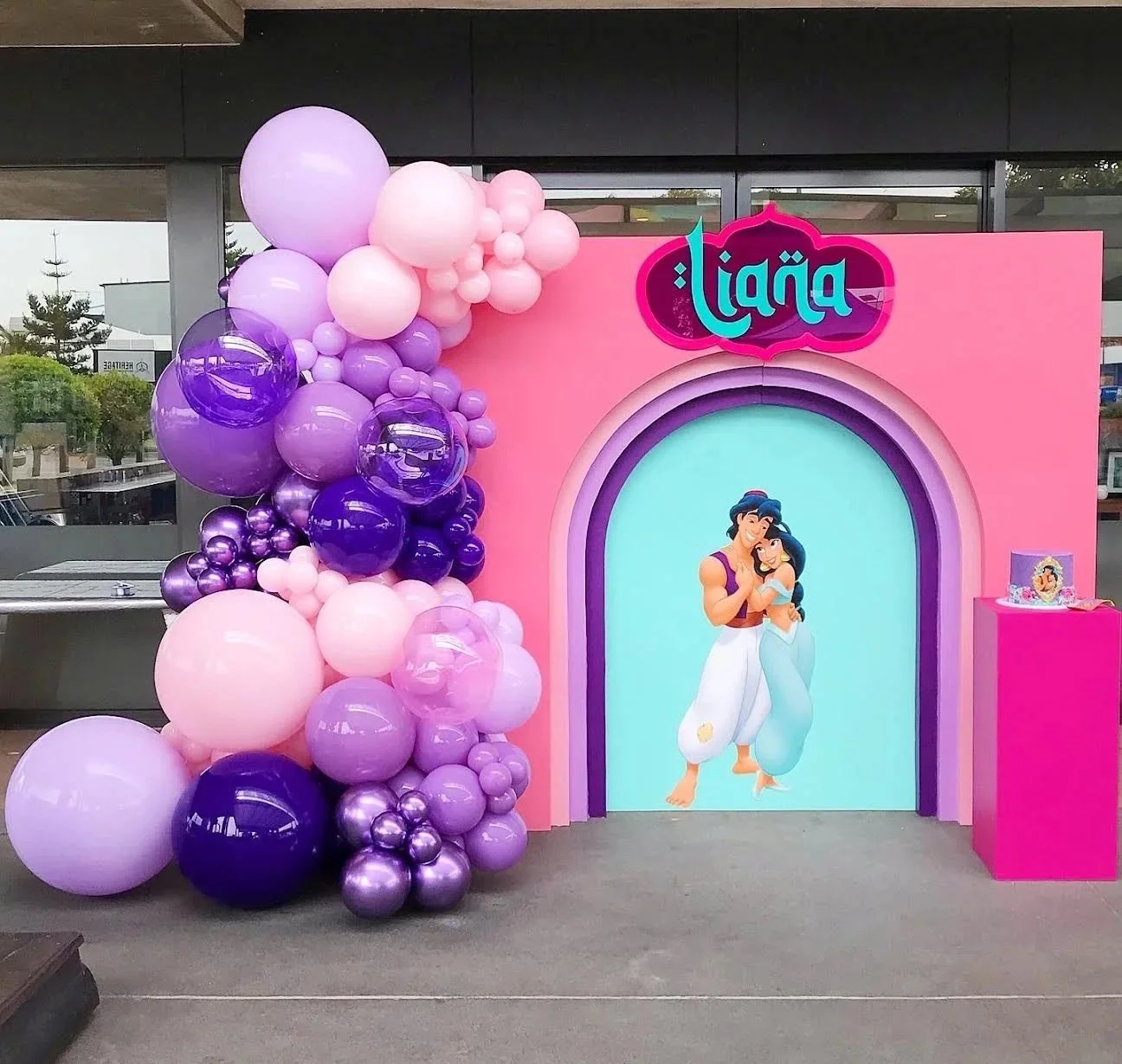 Aladdin and Jasmine Disney party theme with a balloon backdrop 