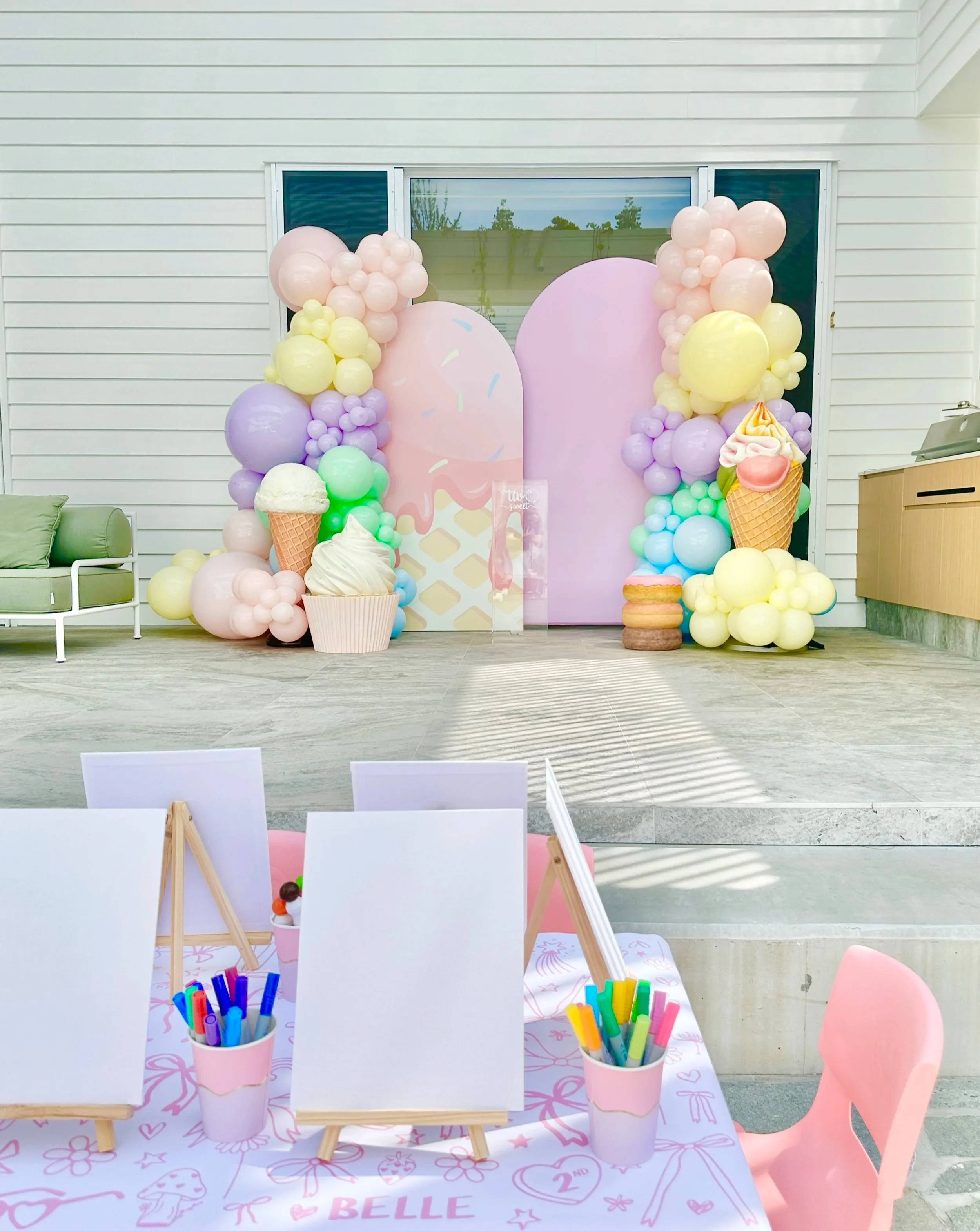 Two Sweet birthday party with balloons and life size ice cream and cupcake props