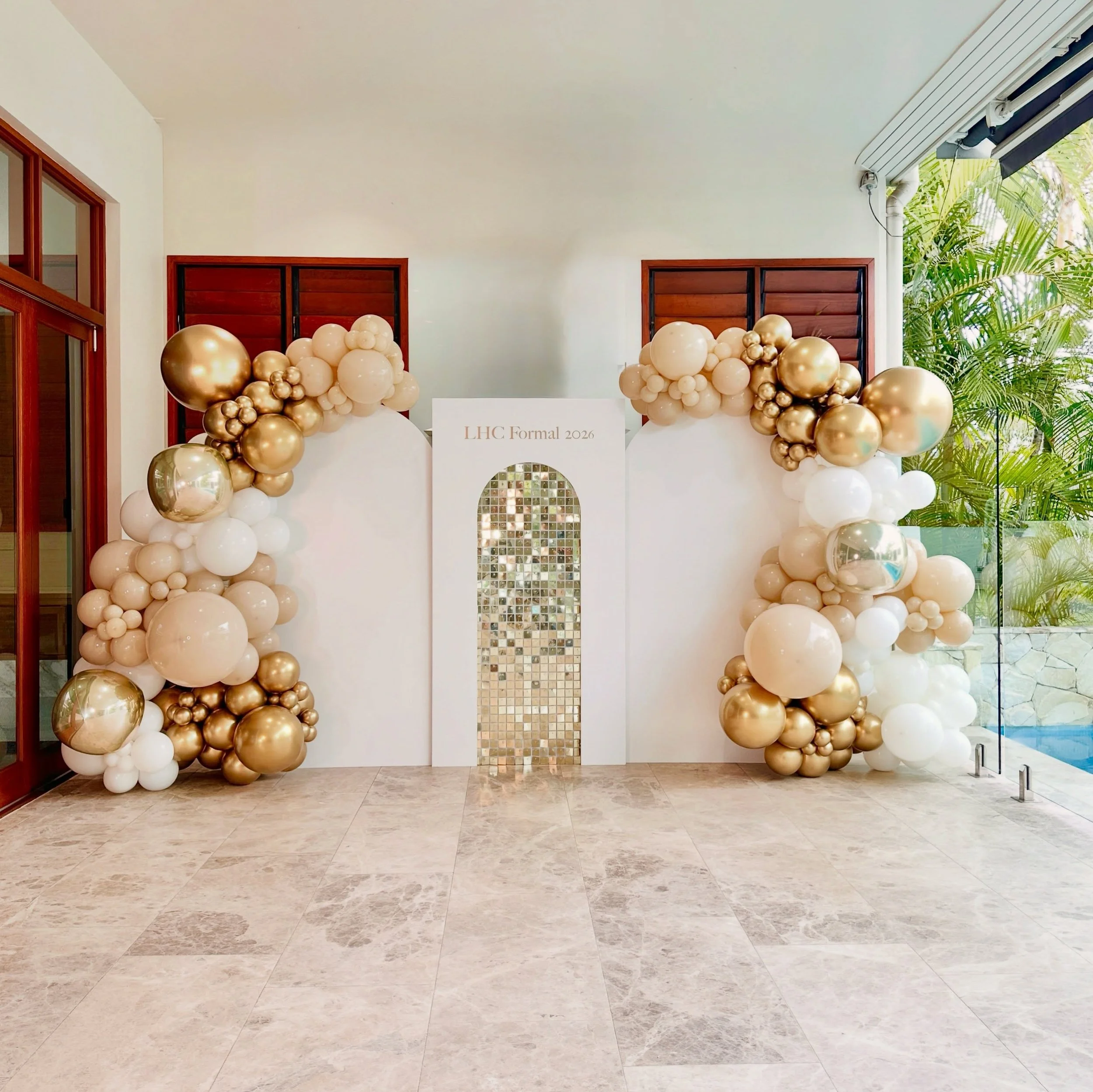 Golden Hour ✨ Formal 2026

We created a classic and modern balloon backdrop for a pre formal party in Brisbane

We used a beautiful colour palette of white, gold and champagne tones with luxe balloons and a shimmering backdrop to create the perfect p