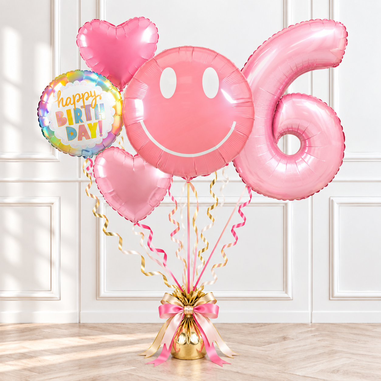 Smiley face helium balloon bouquet with a number balloon, heart balloons and happy birthday balloon by Print Candy
