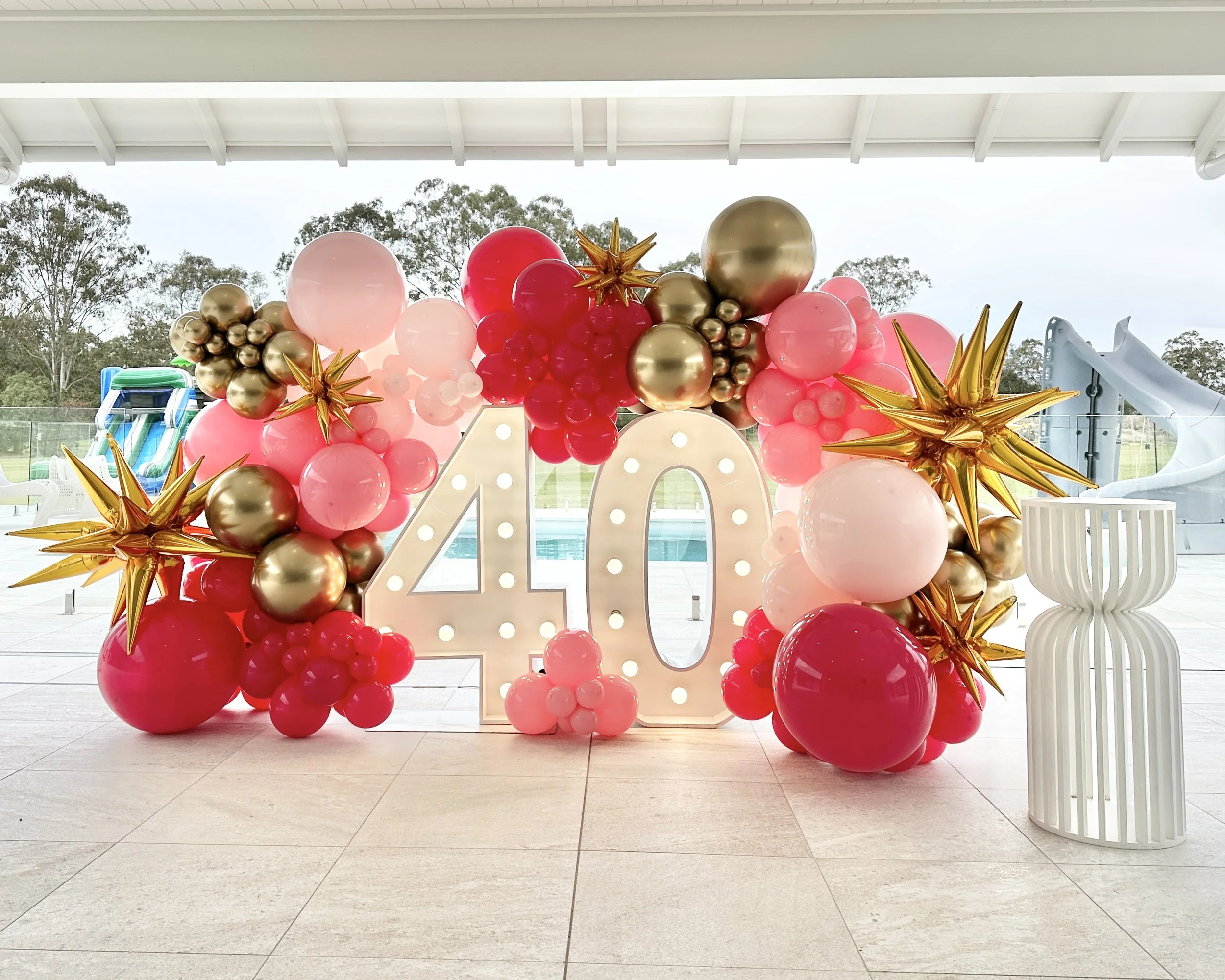 Celebrate four decades in style with style, flair and sophistication. Balloon wall backdrops around light up numbers are perfect for any age. Big, bold, beautiful and fill a room with the perfect party decor to light up your milestones in life