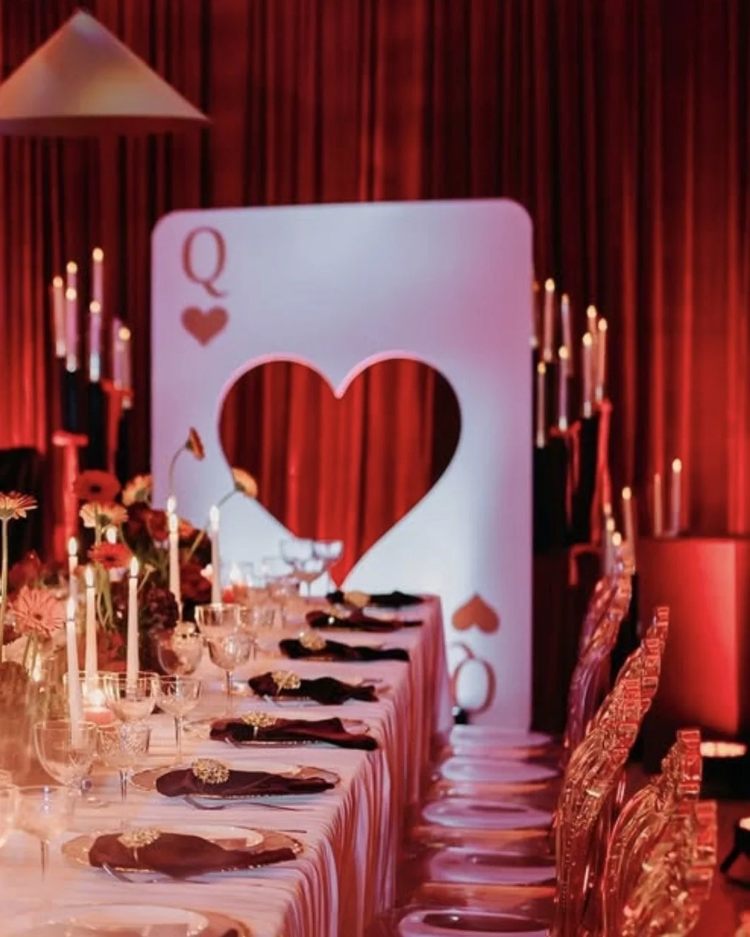 Queen of Hearts playing card backdrop featuring a heart-shaped hole in the center for an engagement party, casino themed birthday or themed event
